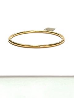 Bracelet jonc mince en or jaune 18 carats de la collection « Essence »