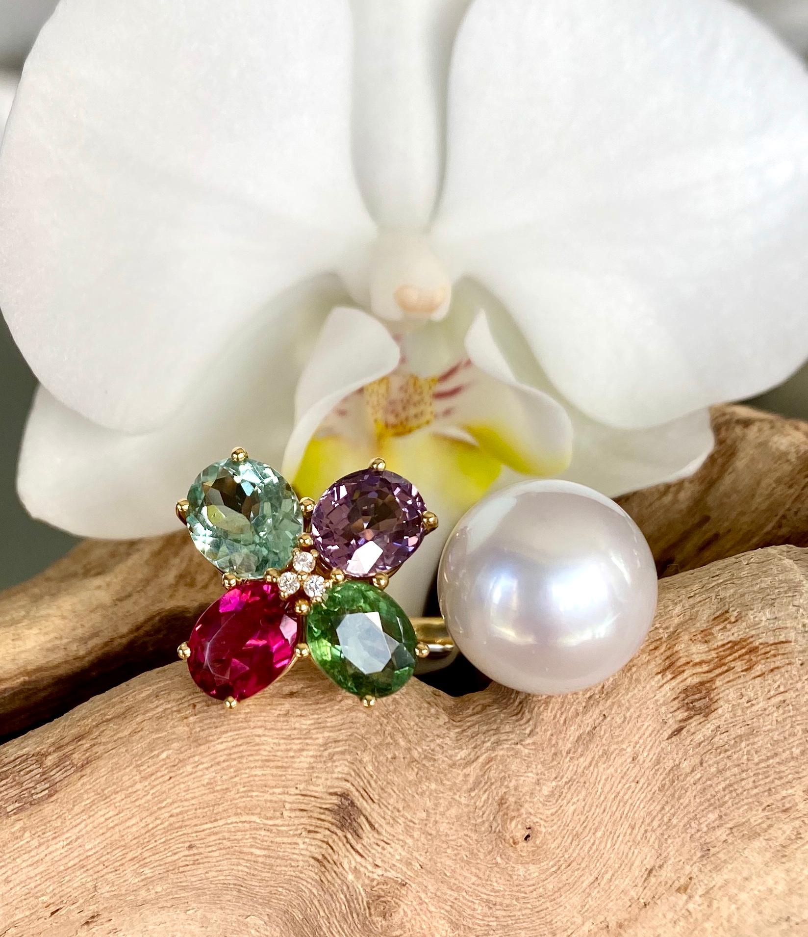 A two-in-one ring of a white South Sea pearl, rubellite and green tourmalines, aquamarine, sapphire and diamonds, handcrafted in 18 karat yellow gold.

This gorgeous one-of-a-kind ring combines a lustrous and luminous South Sea pearl with a