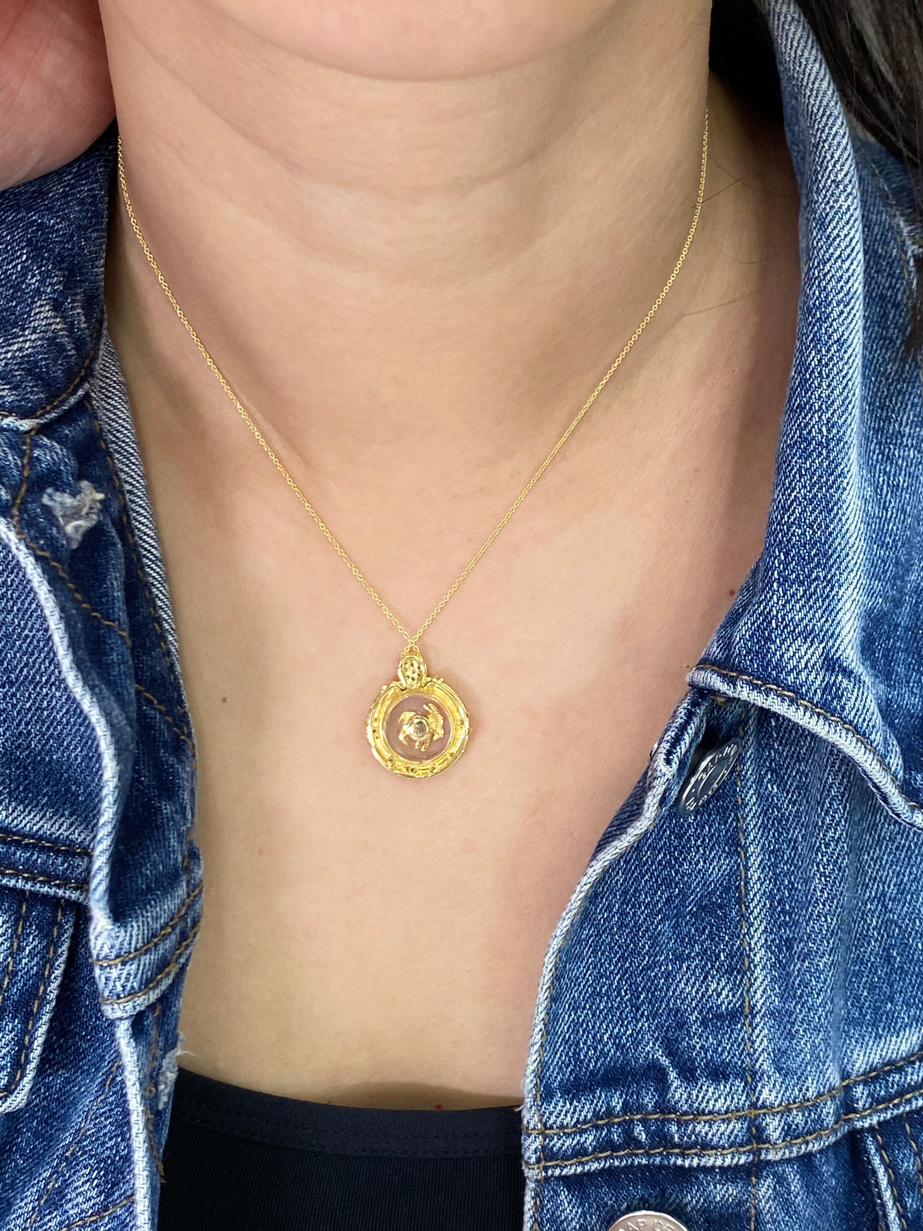Here is a unique pendant that you don't see everyday! In the chinese zodiac, the sheep or goat is the eighth in the 12 year cycle. The pendant is set in 18k yellow gold with approximately 0.15cts of white diamonds. The center goat or sheep moves and