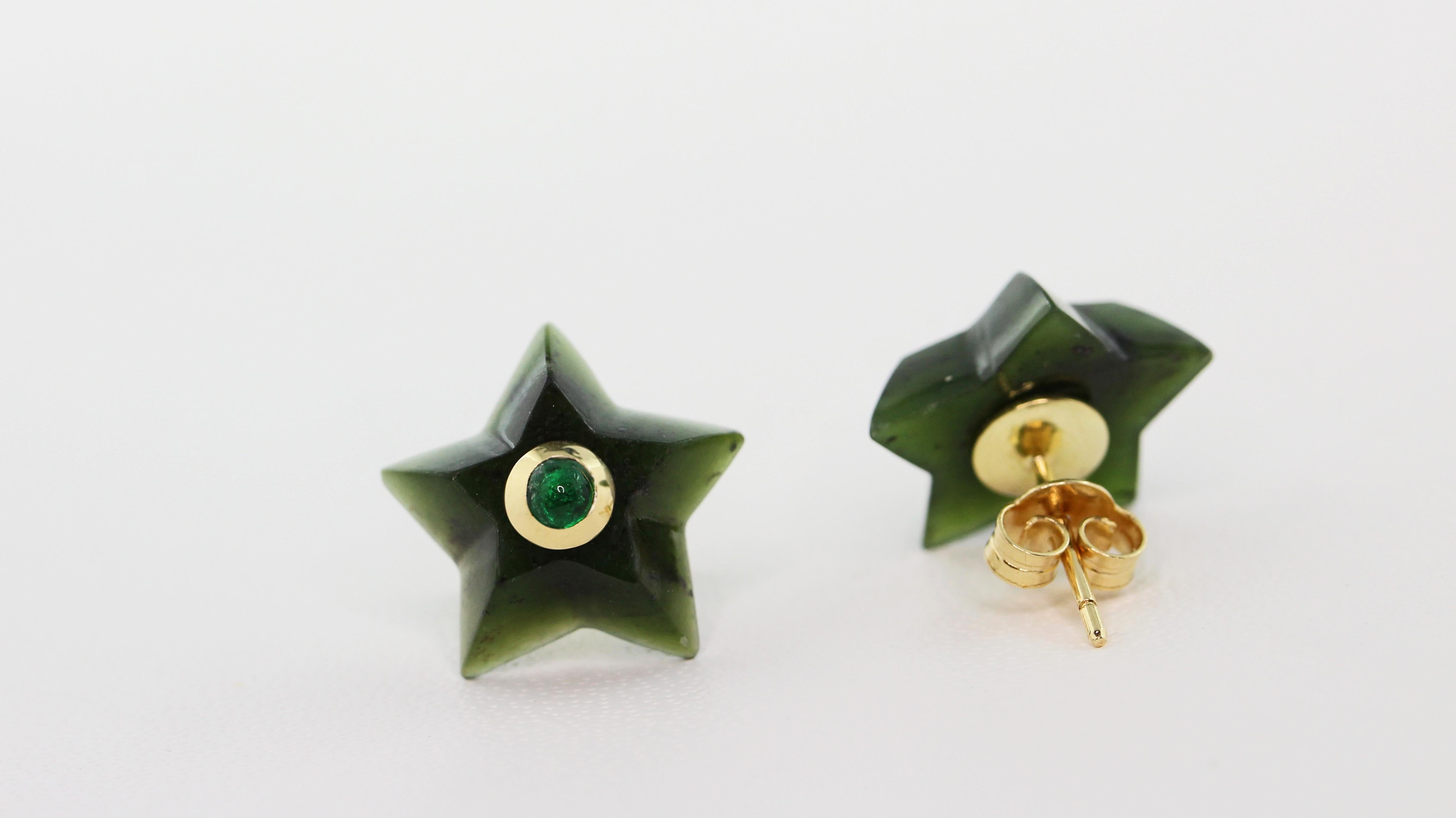 This charming pair of stud earrings is entirely hand carved and made in jade, shaped as stars and adorned in the center with cabochon emerald. 
The mounting is in 18 karat yellow gold. 

Dimensions:
                    1.4 x 1.4 cm circa
           