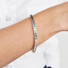 14 Karat Yellow Gold Step Cut Gradient Blue Topaz Square Tennis Line Bracelet