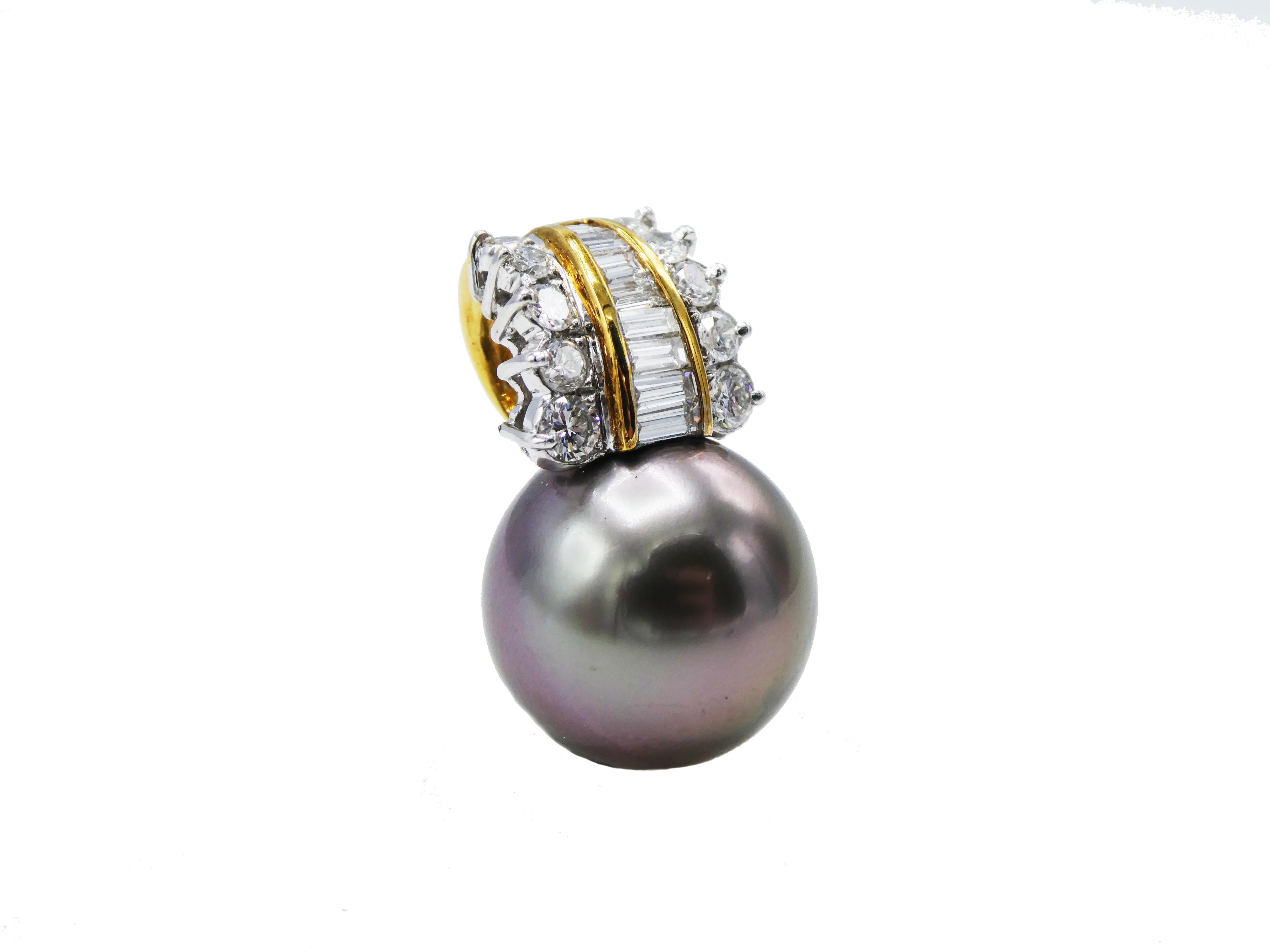 18 Karat Yellow Gold Tahitian Pearl & 1 CTW Diamond Pendant
Metal: 18 karat yellow gold
Weight: 7.13 grams
Diamonds: Round & baguette diamonds, approx. 1 CTW G VS
Length: 23MM
Width: 14MM
Pearl: Cultured gray Tahitian 14MM 
*Pendant only, does not