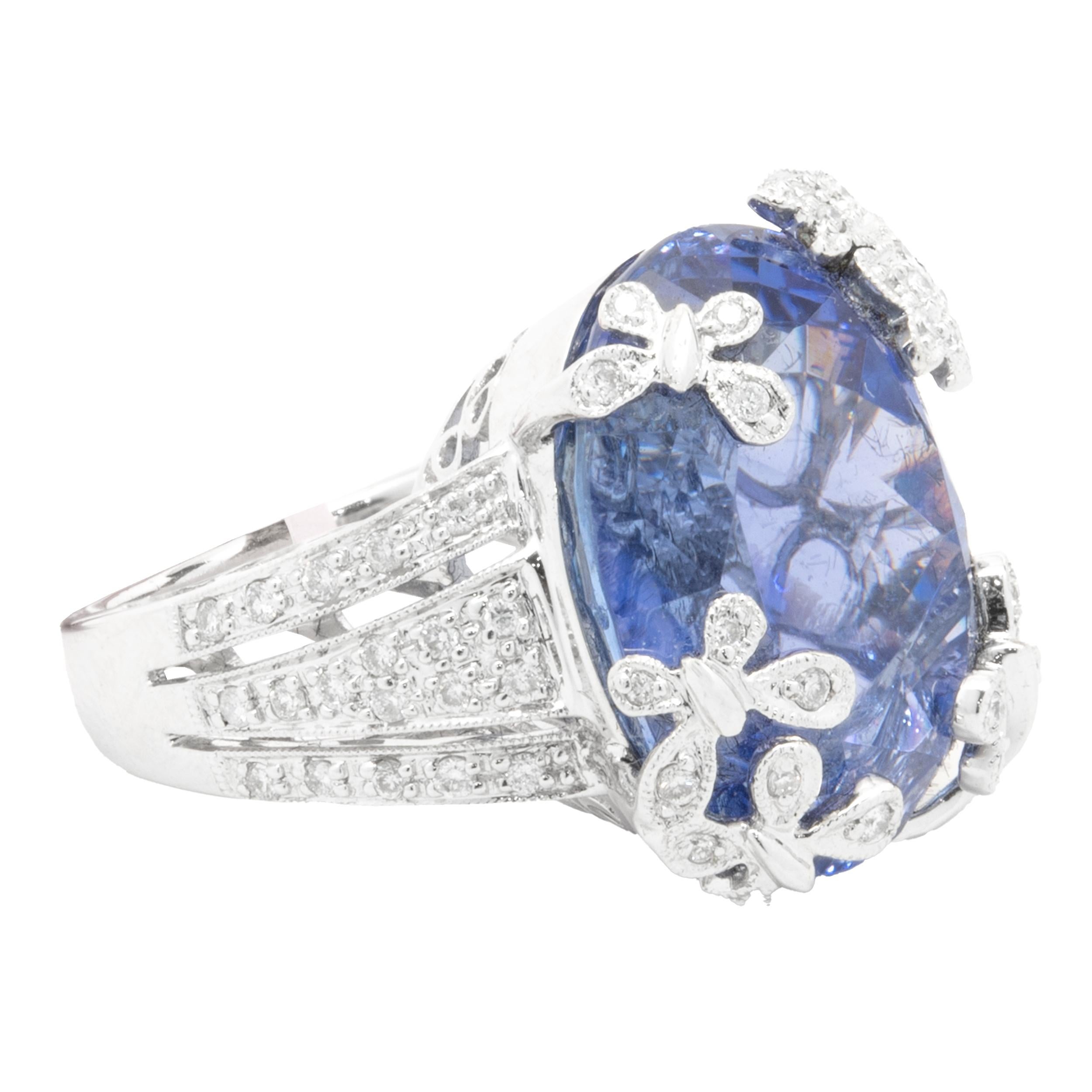 Designer: custom
Material: 18K white gold
Diamond: 60 round brilliant cut = 0.40cttw
Color: G
Clarity: VS1-2
Tanzanite: 1 oval cut = 22.46ct
Ring Size: 6 (complimentary sizing available)
Weight: 13.20 grams