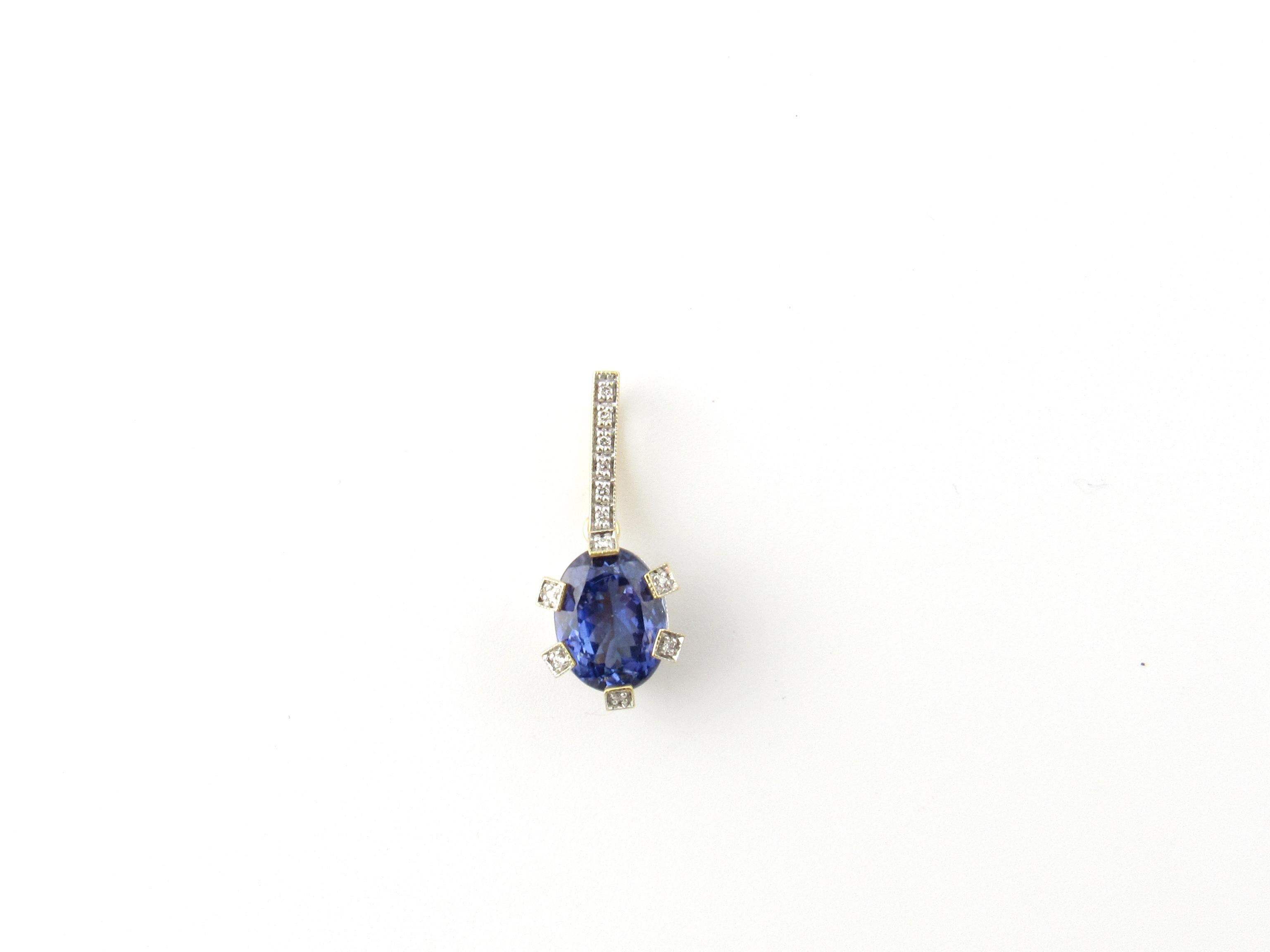 Vintage 18 Karat Yellow Gold Tanzanite and Diamond Pendant-

This stunning 18K yellow gold pendant features one oval tanzanite (11 mm x 9 mm) and 58 round brilliant cut diamonds set in an elegant basket setting and on bale.   

Oval Tanzanite is