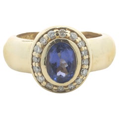 Anello con tanzanite e diamante in oro giallo 18 carati
