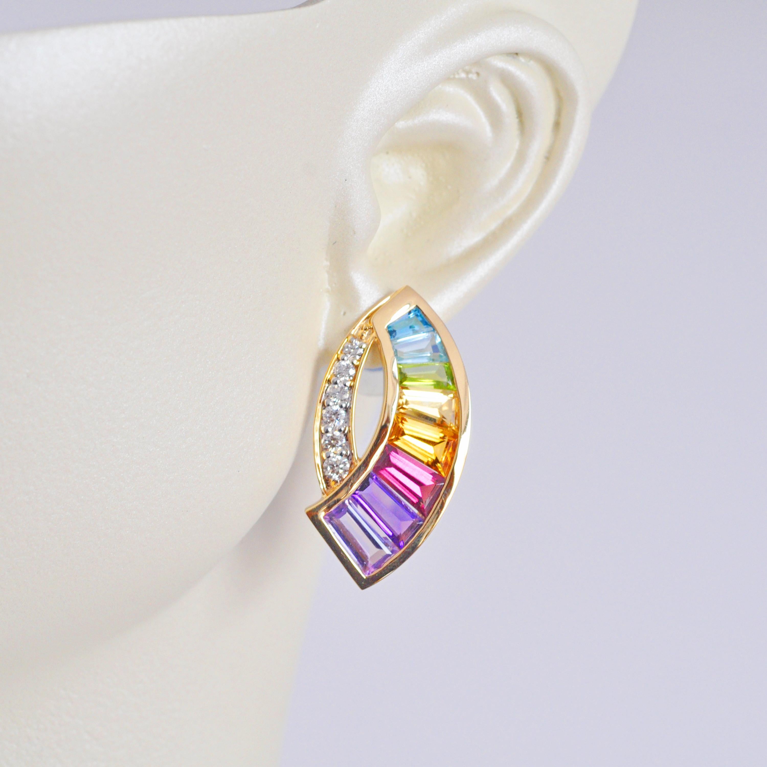 18 karat yellow gold taper baguette rainbow gemstones modern curve stud earrings. 

Introducing our exquisite rainbow sickle diamond stud earrings, a true marvel in the world of fine jewelry. These earrings are a mesmerizing fusion of sophistication