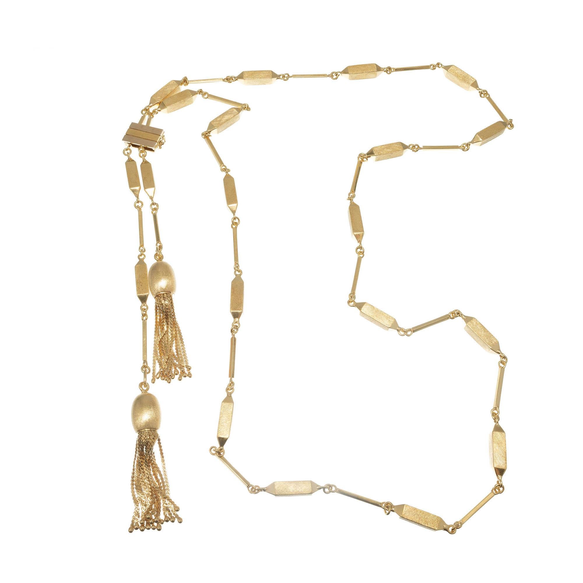 Y style Tassel of adjustable length with tassel ends. Solid 18k Yellow Gold. Circa 1950-1960.

18k Yellow Gold 
Stamped: 750
65.6 Grams
Chain: 40 Inches
Total Length: 43 Inches
Width: 4.8mm??????
Thickness/Depth: 42 Inches
