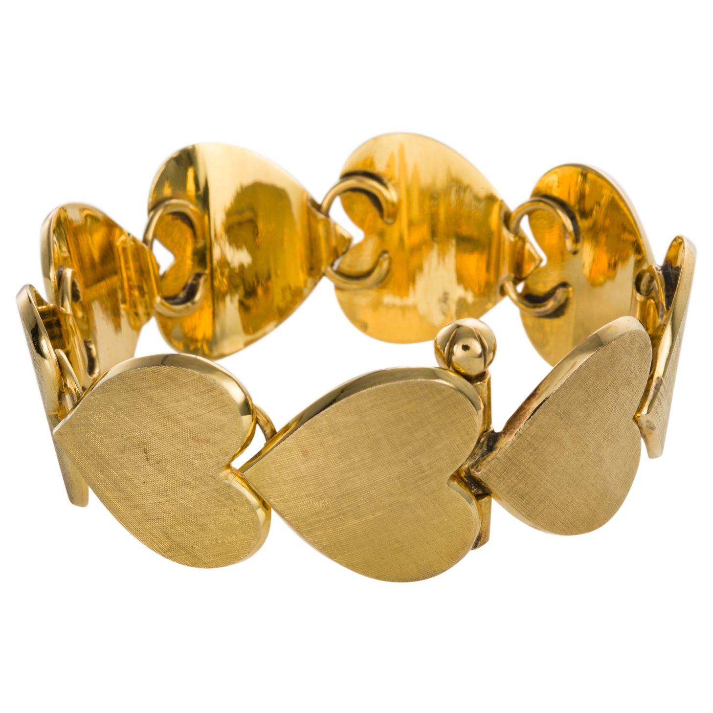 Are you one of those people who love heart jewellery? Well here is something that will make your heart flutter. This solid 18k yellow gold textured heart bracelet which consists of 9 beautifully crafted heart motifs displaying a detailed