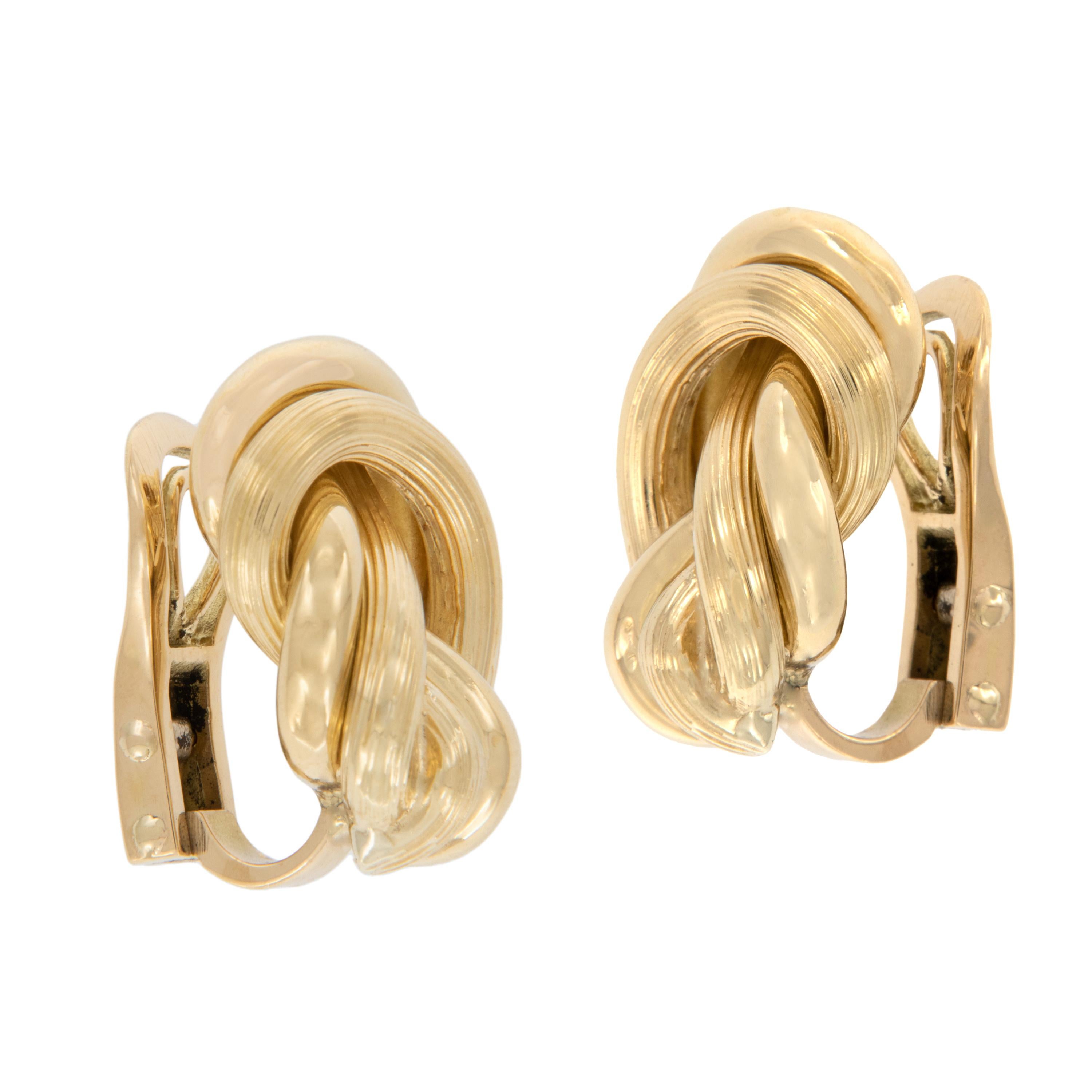 These elegant earrings have everything all tied up & ready to go! Made from rich 18 karat yellow gold these knot earrings have the edge with the subtle lined texture creating a soft, warm look. Heavy duty clip backs for security of wear.