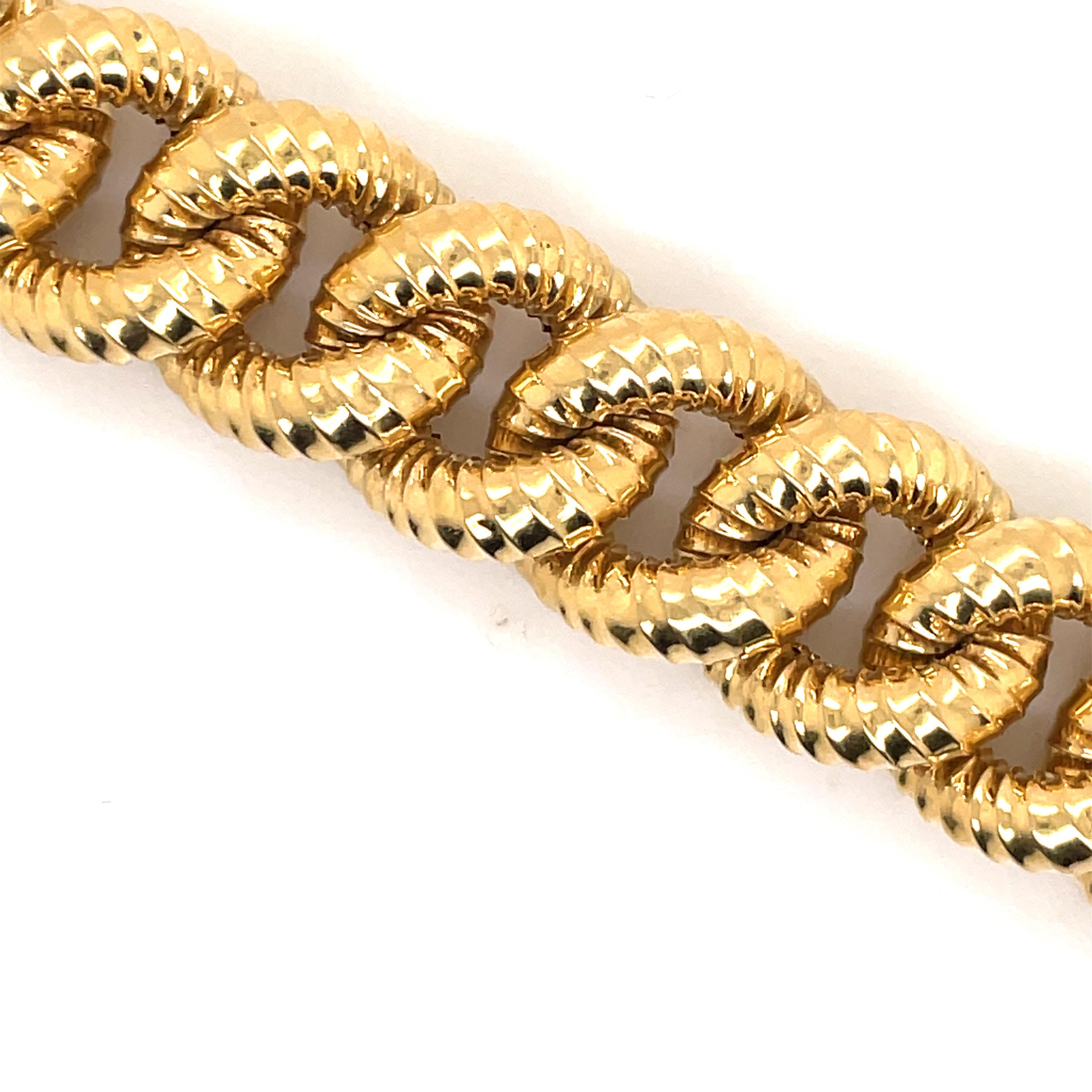 18 Karat Yellow Gold bracelet featuring 19 textured links weighing 34.9 grams. Stamped 
Stamped Marlia with Sun Hallmark 750