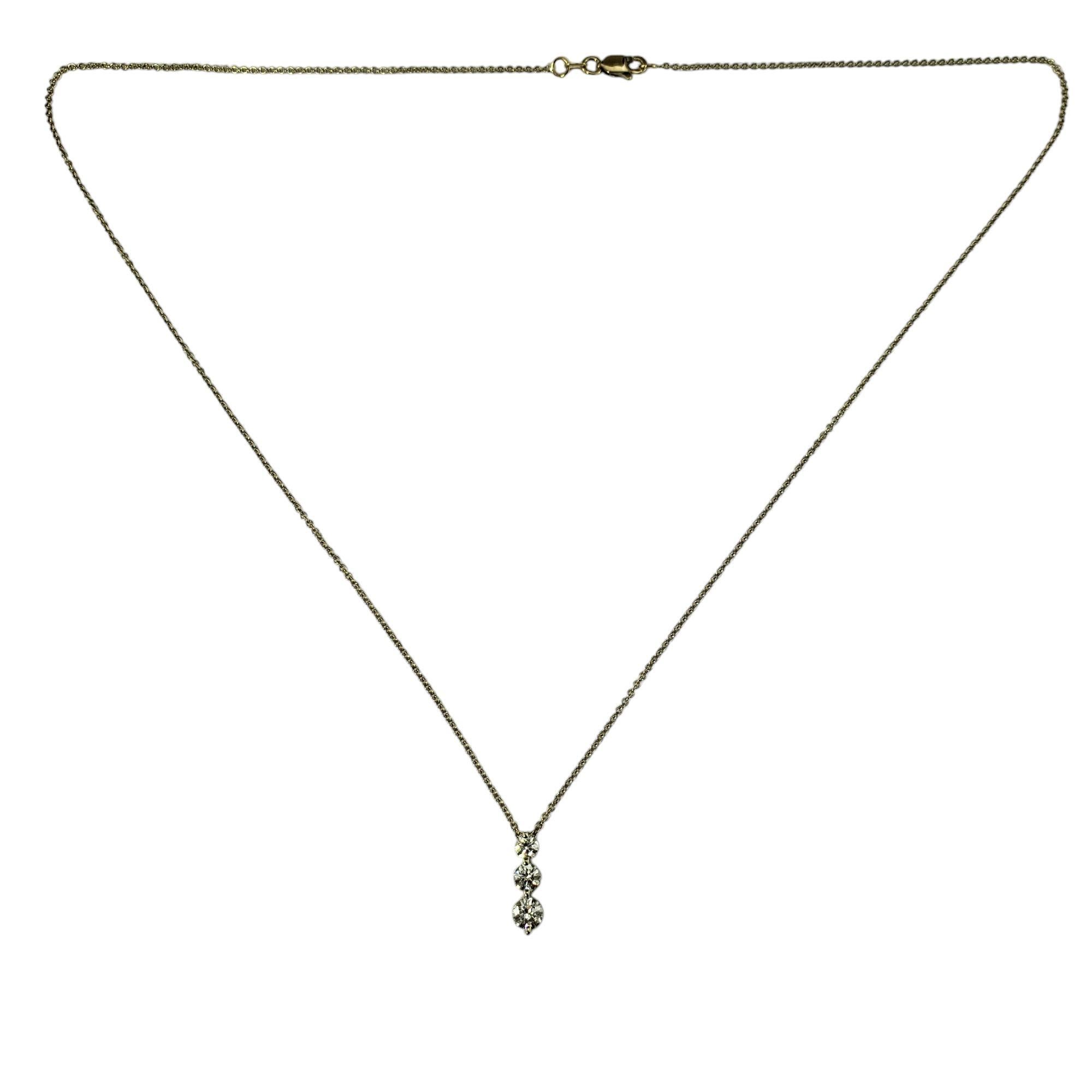 18 Karat Yellow Gold Three Diamond Pendant Necklace-

This sparkling pendant necklace features three round brilliant cut diamonds (.11 ct., .17 ct., .23 ct.) set in classic 18K yellow gold.

Approximate total diamond weight: .41 - .51 ct.

Diamond