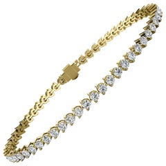 Bracelet tennis à trois griffes en or jaune 18 carats et diamants de 3 carats