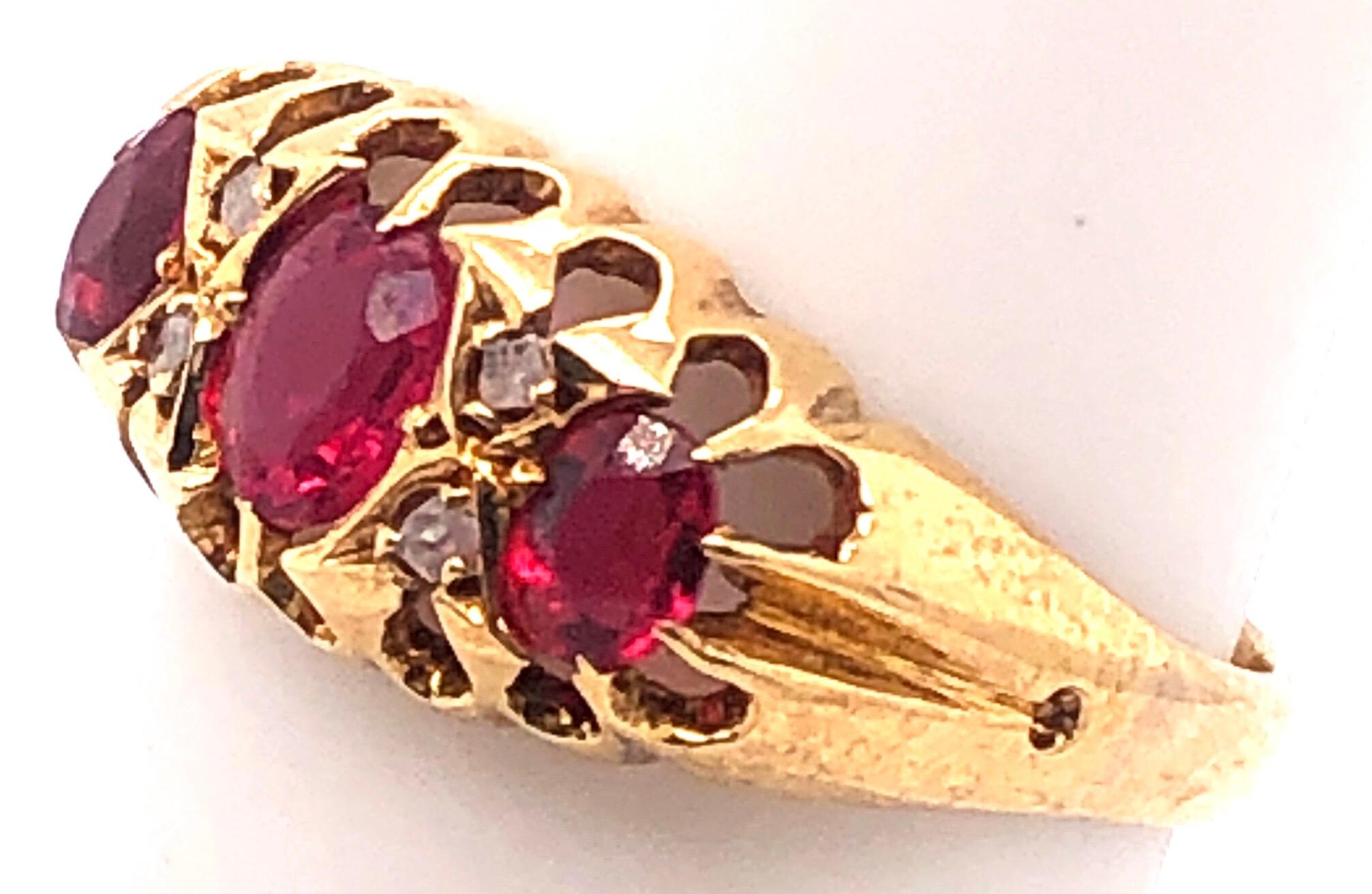 18 Karat Yellow Gold Three Stone Ruby Ring With Diamond Accents
0.04 total diamond weight.
Size 5.5
2.94 grams total weight.