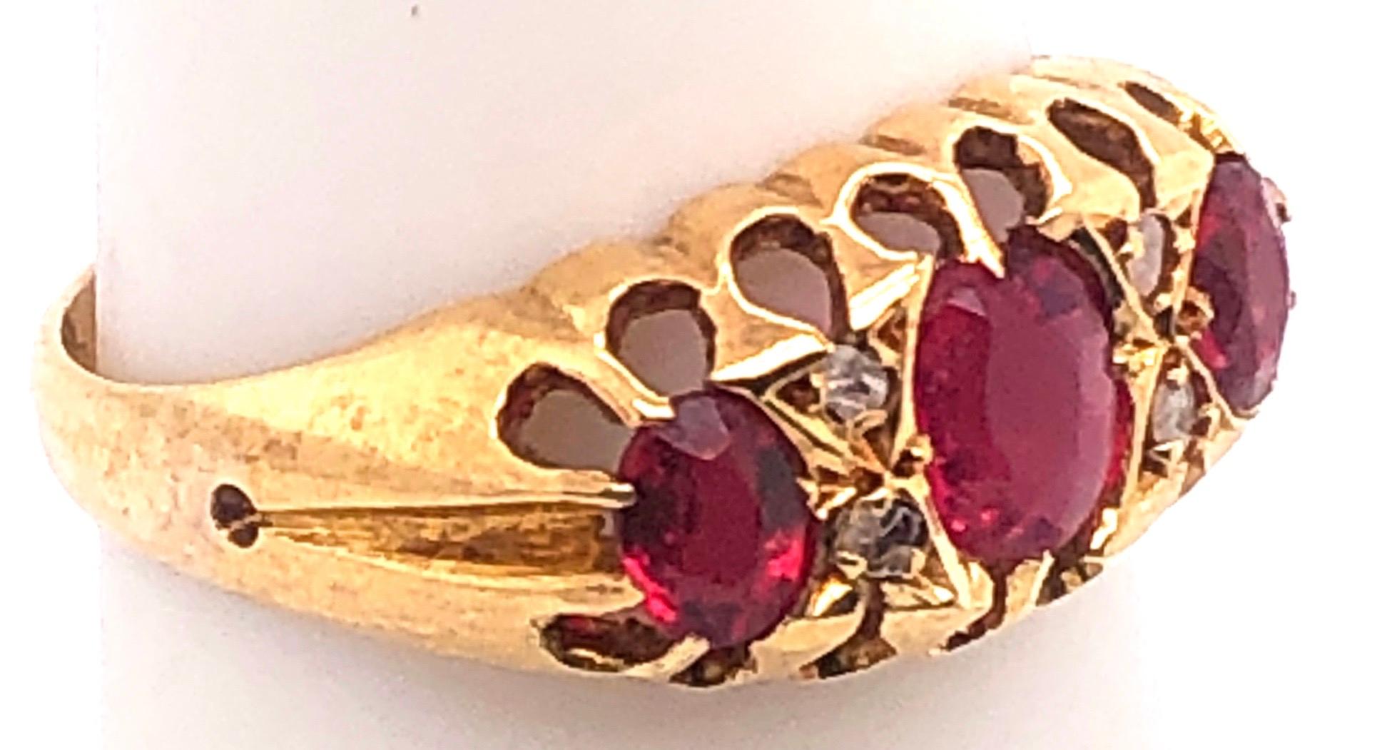 18 Karat Yellow Gold Three-Stone Ruby Ring Band with Diamond Accents In Good Condition For Sale In Stamford, CT