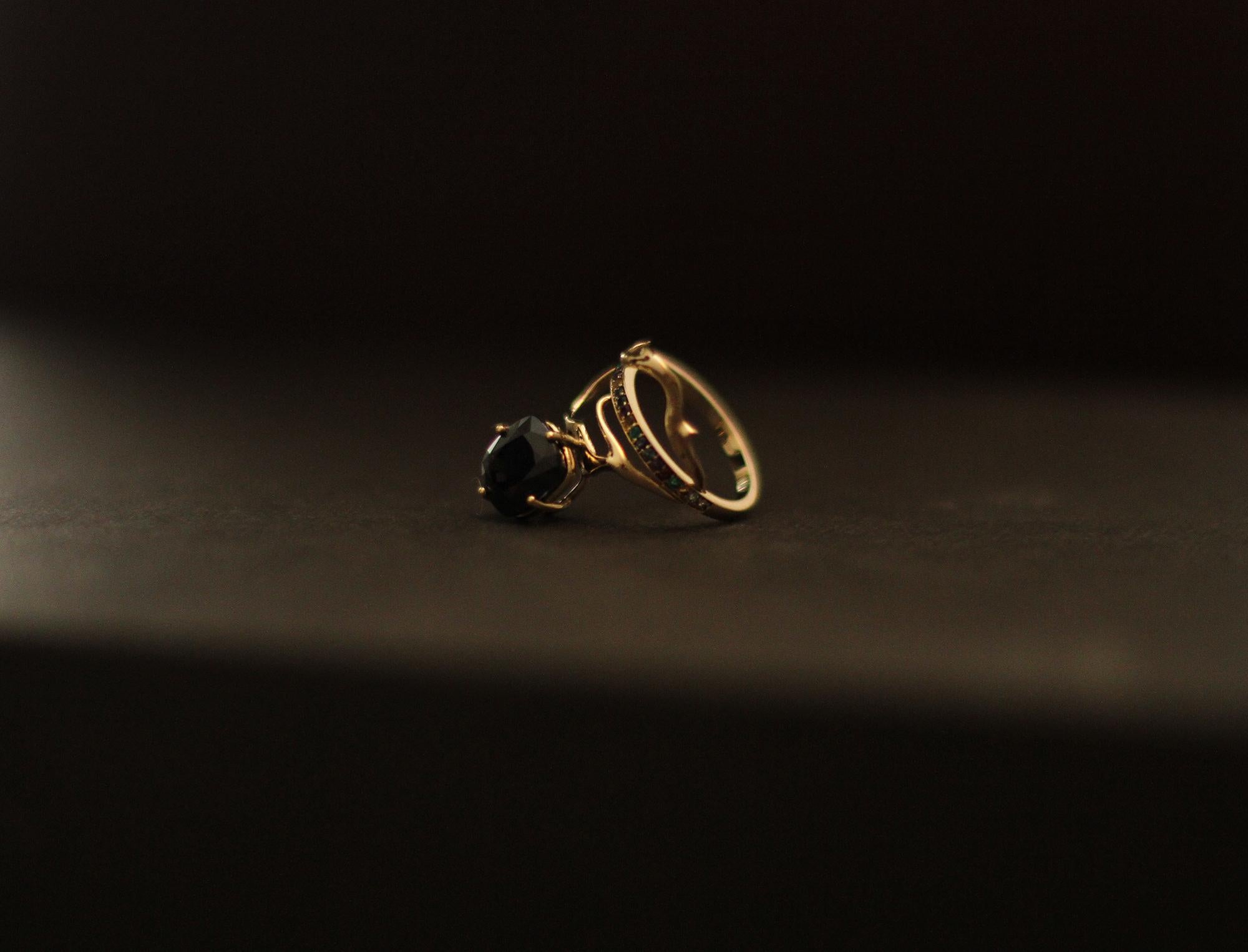 This Tibetan-inspired 18 karat yellow gold contemporary cocktail ring is an art object with an unusual form. Encrusted with F/G, SI diamonds and a big dark blue cushion sapphire (very dark blue), this piece was inspired by Tibetan culture and