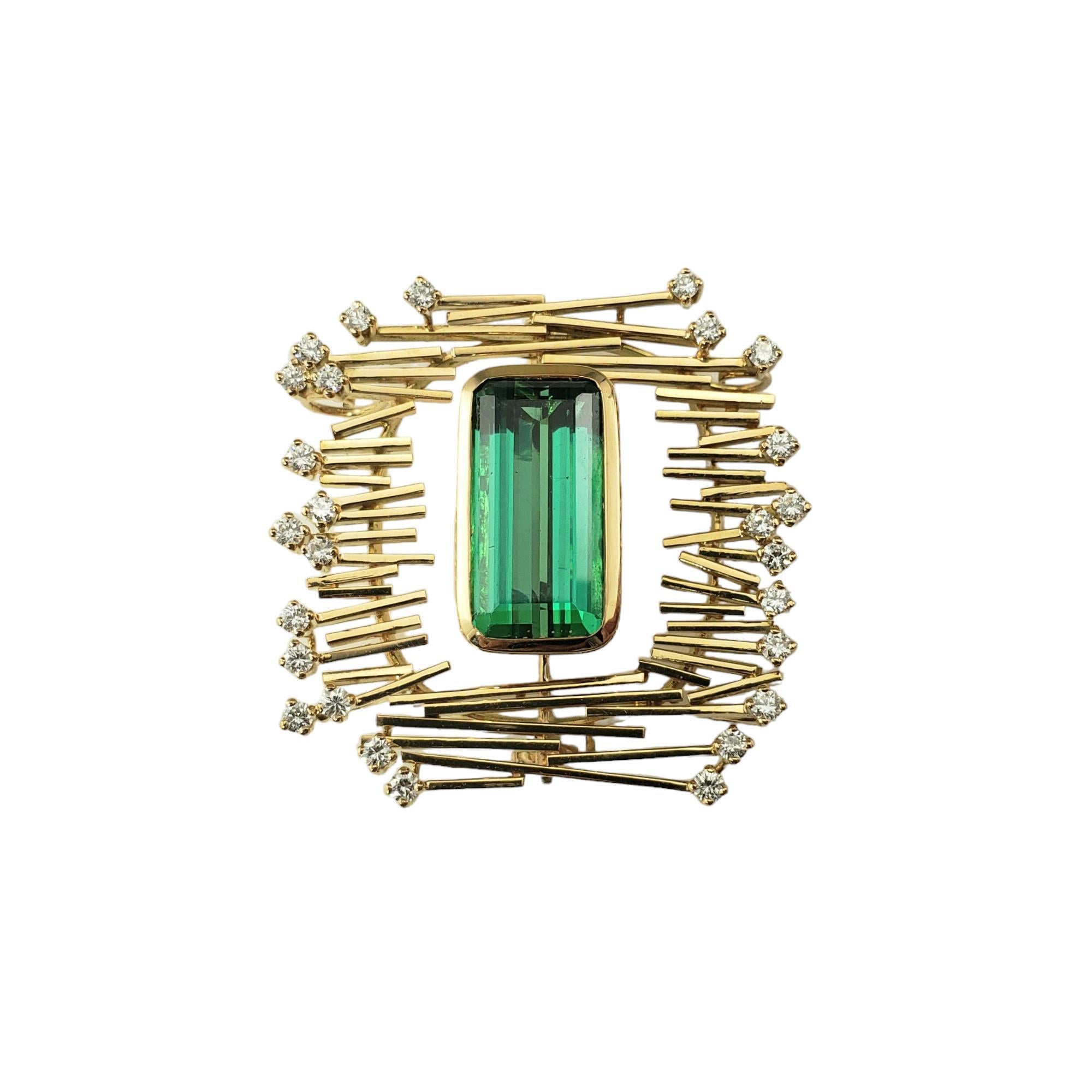 18 Karat Yellow Gold Tourmaline and Diamond Brooch/Pendant JAGi Certified-

This stunning abstract design piece features one emerald cut green tourmaline (16.9 mm x 8.4 mm) and 27 round brilliant cut diamonds set in beautifully detailed 18K yellow
