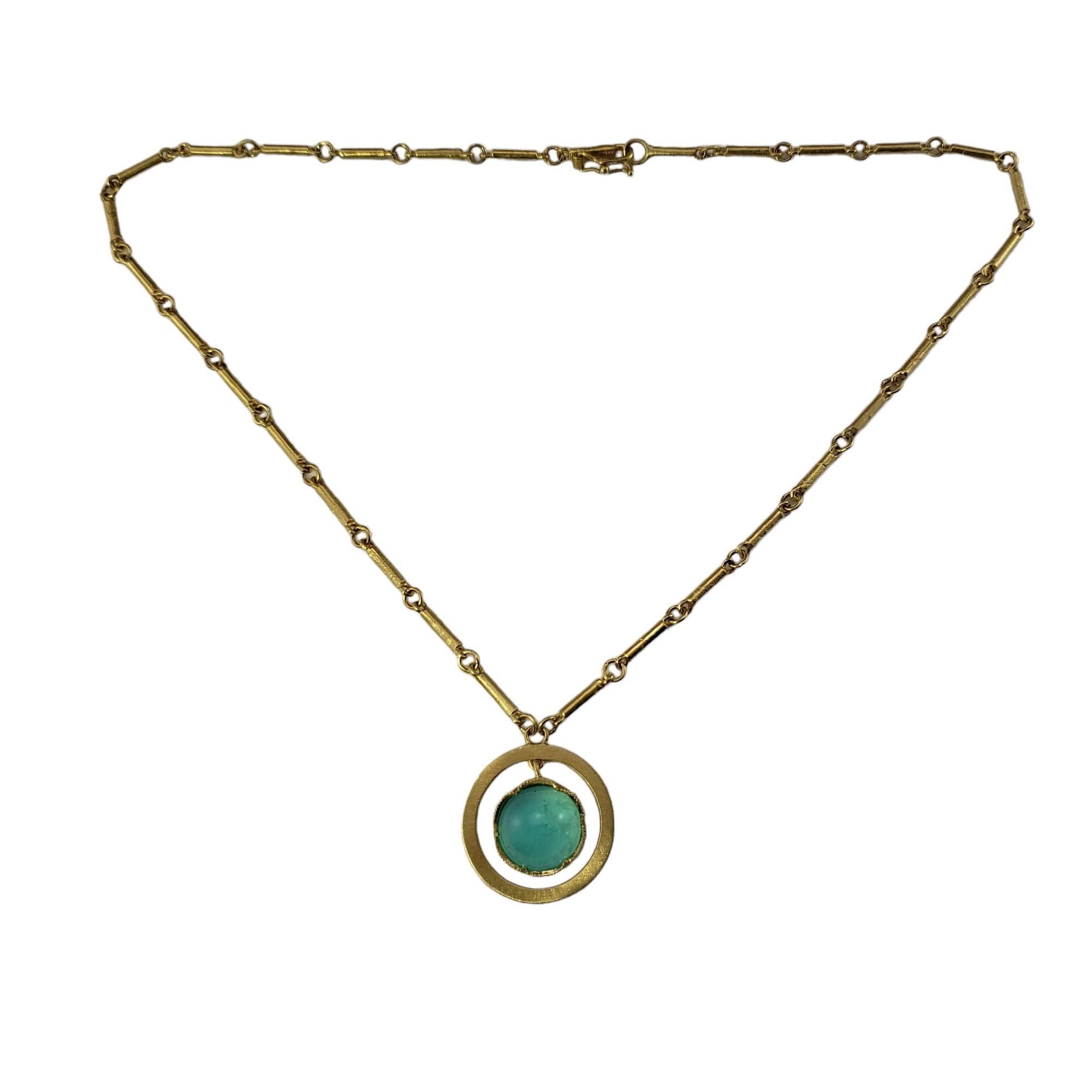 Vintage 18 Karat Yellow Gold Tourmaline Pendant Necklace-

This stunning pendant necklace features one blue/green tourmaline stone (11 mm) set in beautifully detailed 18K yellow gold.

Size: 15 inches (necklace)
         20 mm (pendant)

Stamped: