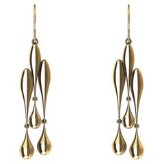 Boucles d'oreilles creuses en or jaune 18 carats à trois gouttes d'eau