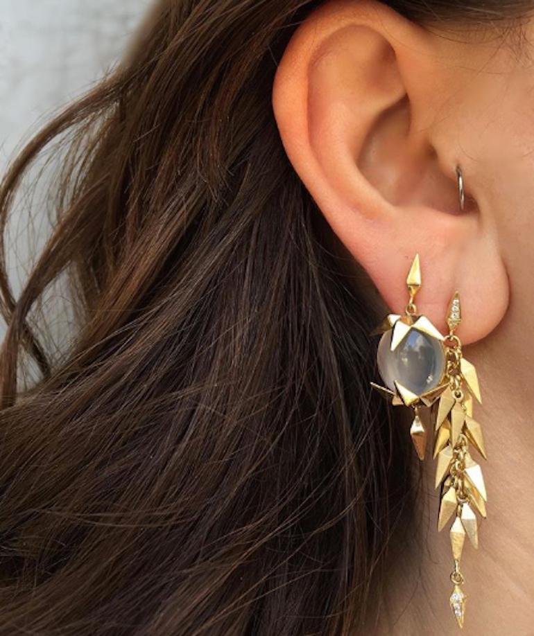 Trickling Icicle Dangle Earrings feature Karma El Khalil's signature pyramid spike motif with white diamond studs and clusters of solid yellow gold pyramid spikes dangling down and finished at the tips with diamonds.

18k Yellow Gold : 16.62g
White