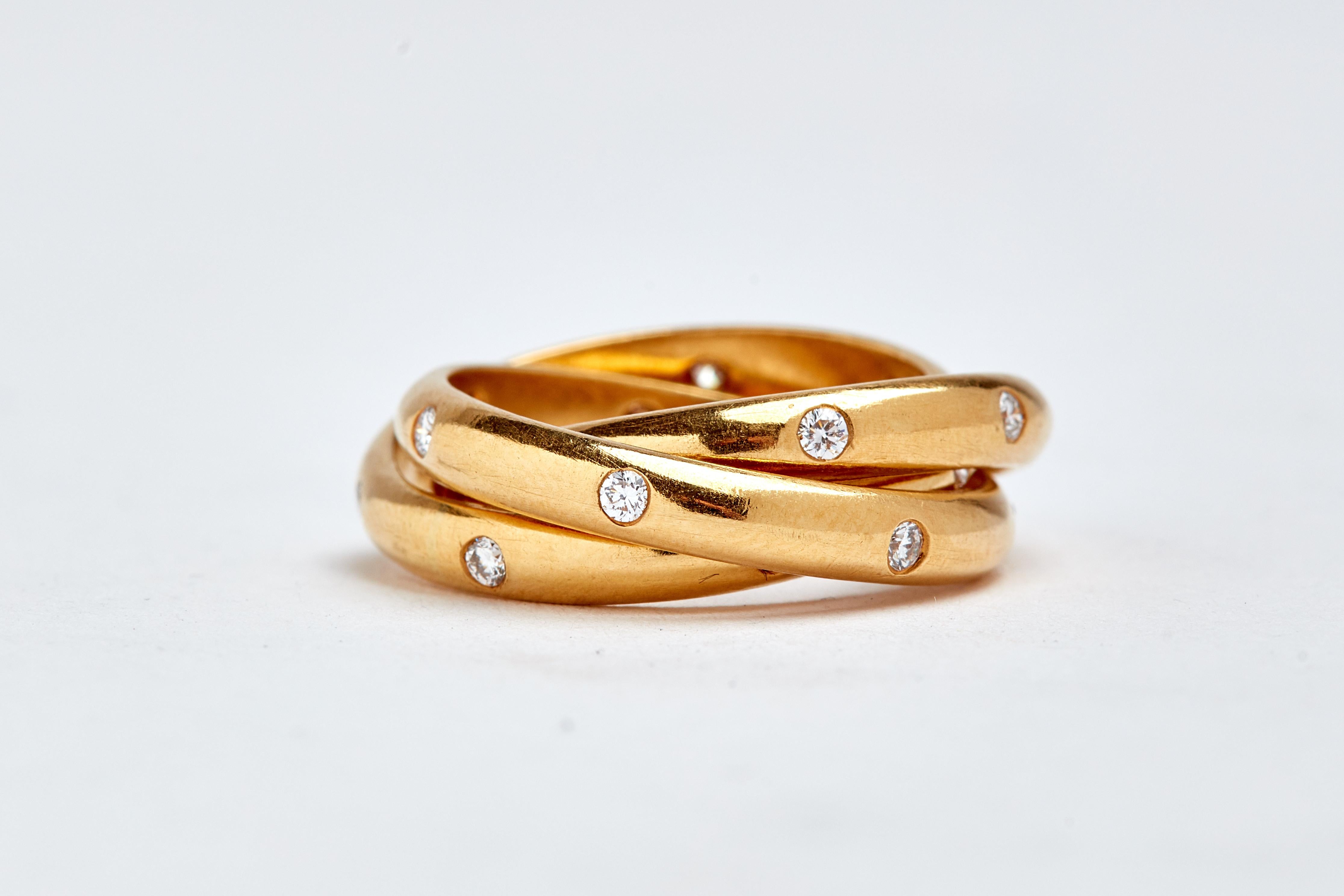 18k yellow gold triple rolling ring with diamonds. 24 round white diamonds. aprox 0.75 carats total. size 5.25
