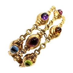 18 Karat Yellow Gold Triple-Stand Bracelet with Eleven Multicolored Tourmalines