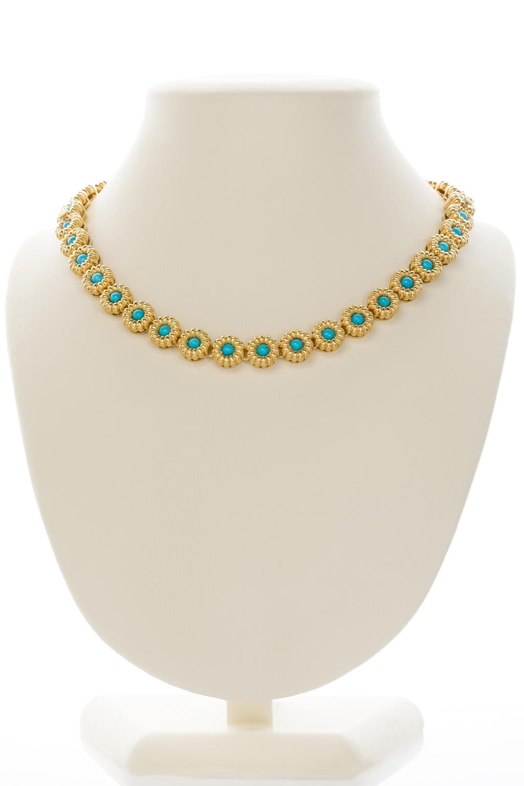 Pretty, versatile and so wearable, these two 18k yellow gold turquoise bracelets can convert to a choker style necklace, each one a line of sculpted gold floral links centering on turquoise cabochons. They may be joined together and be worn as a