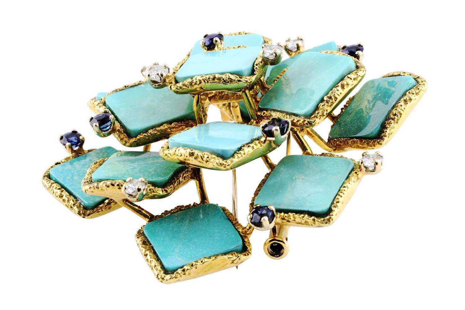 Estate Turquoise Brooch. 18k yellow gold French Hallmark estate brooch set with turquoise with diamond and sapphire accents. The 6 diamonds weigh approximately 0.50cttw and the 6 sapphires weigh approximately 0.78cttw.