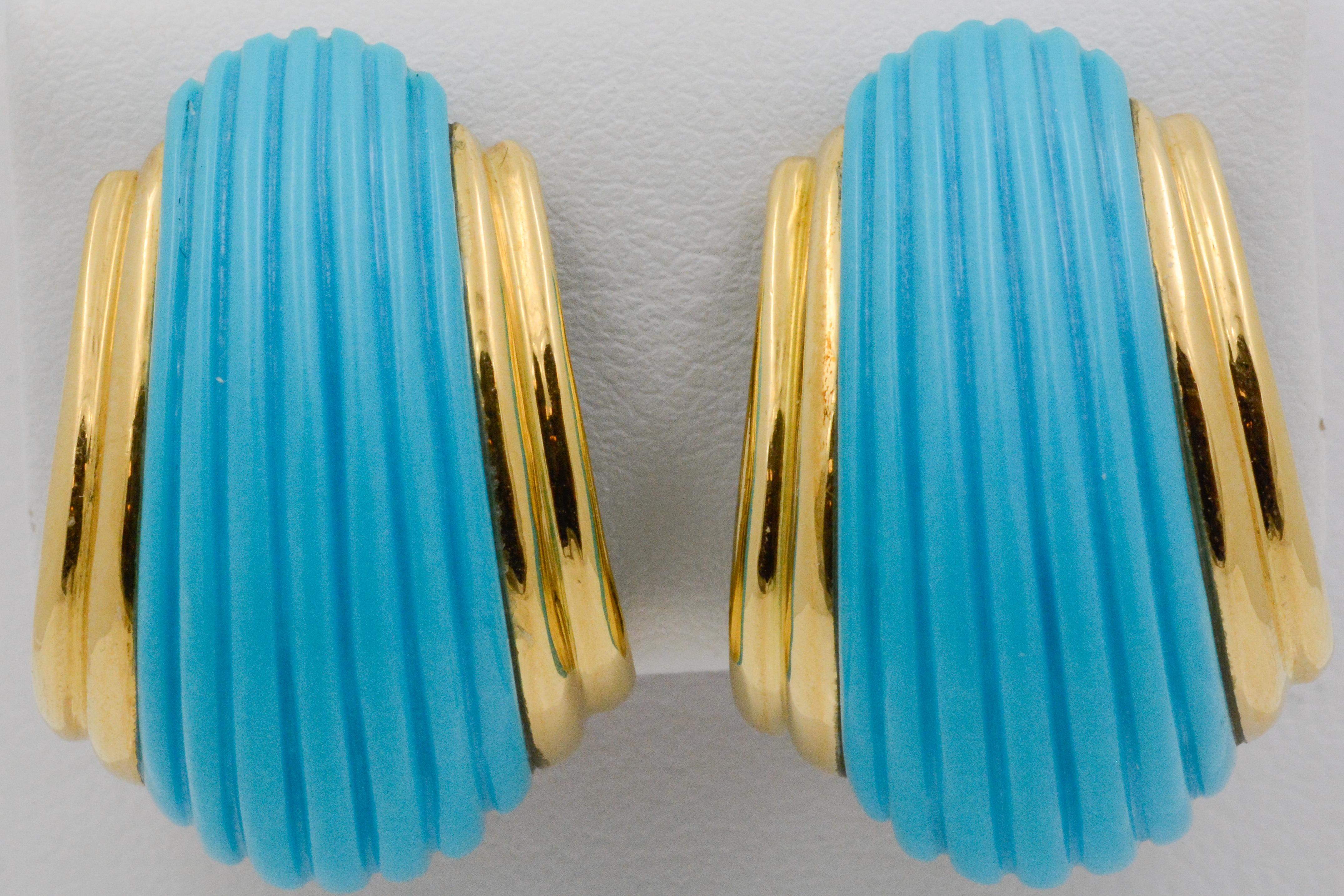 These contemporary turquoise earrings have a ribbed dome design with a splash of 18k yellow gold. These earrings have a clip-on backing. 


