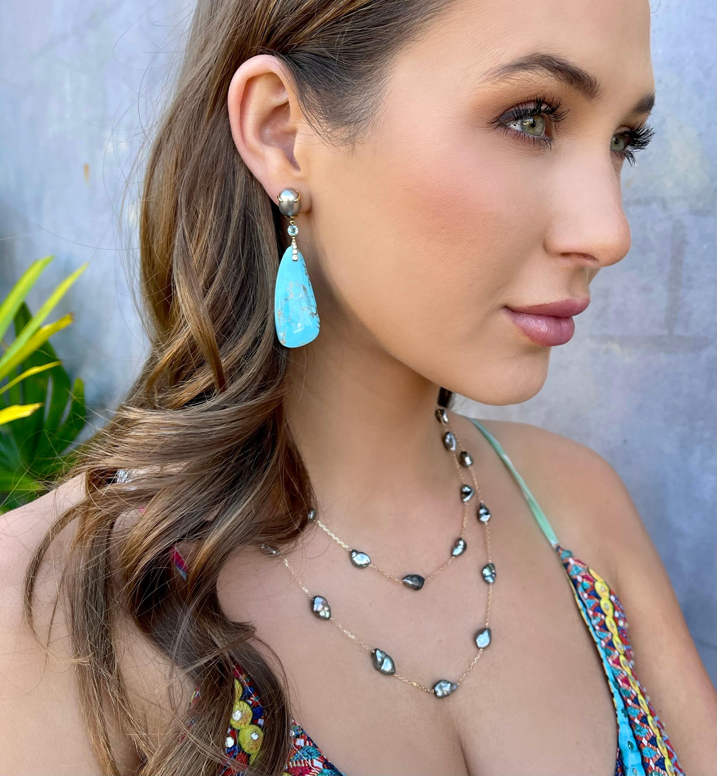 Turquoise, keshi pearl, blue topaz and diamond dangle earrings, handcrafted in 18 karat yellow gold.

These are one-of-a-kind long and elegant turquoise drop earrings that dangle from lustrous grey keshi pearls and a blue topaz center stone. The