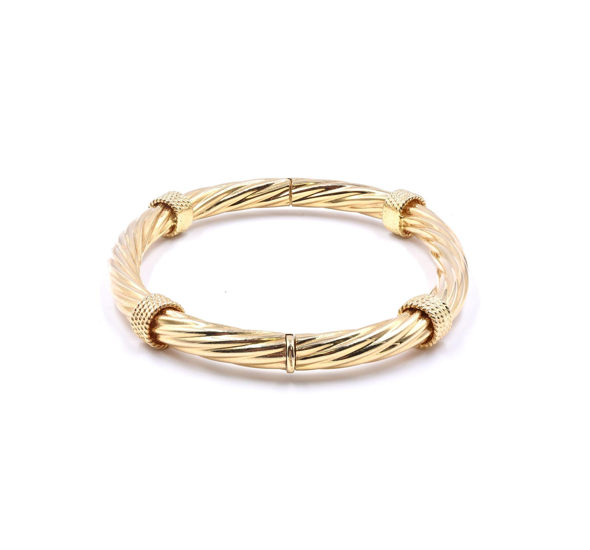 Designer: custom 
Material: 18k yellow gold
Dimensions: the bracelet will fit up to a 8.5-inch wrist, bracelet measures 8.5mm wide
Weight: 23.01 grams
