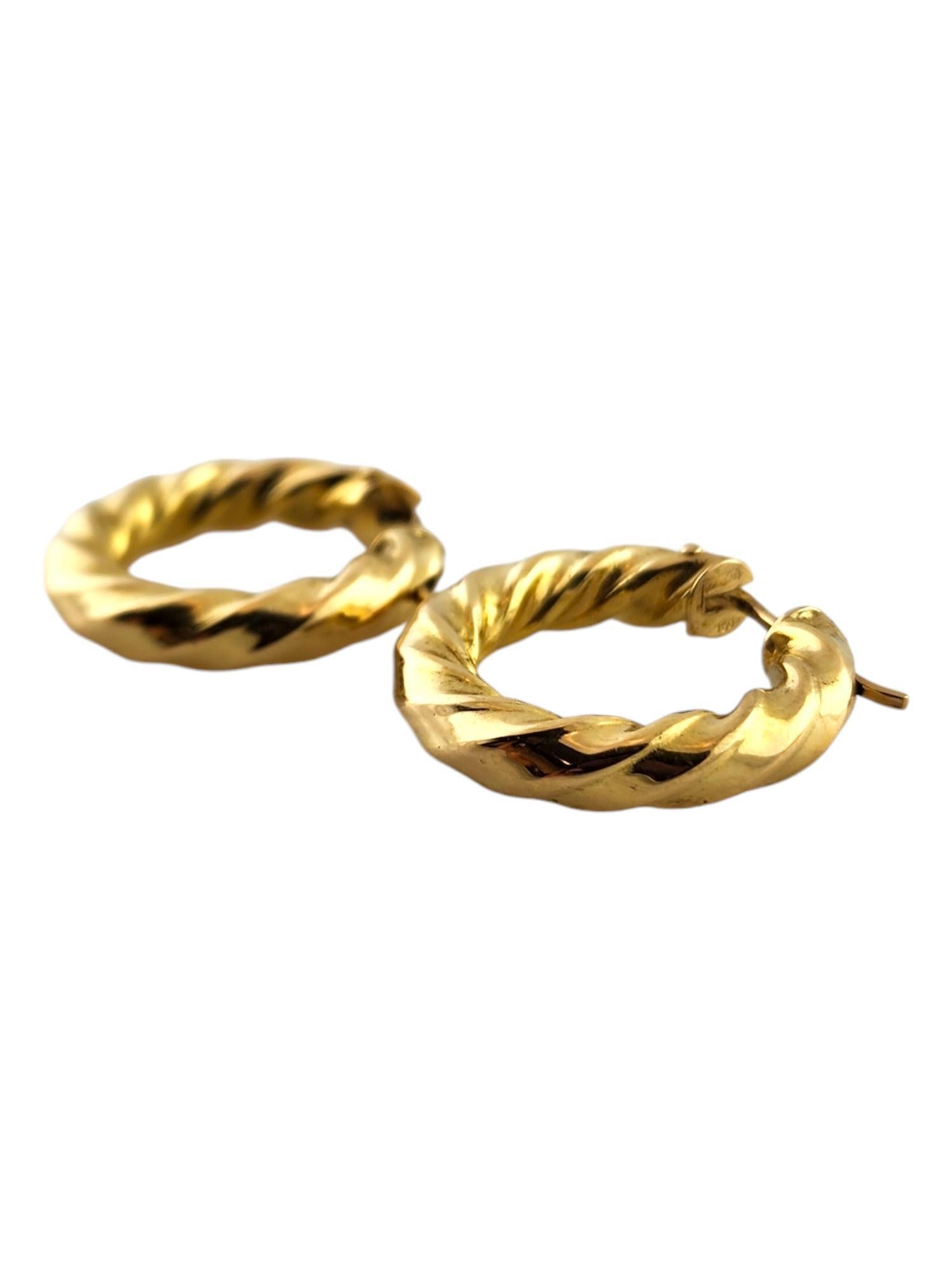 18 Karat Yellow Gold Twisted Hoop Earrings

This gorgeous set of twisted Hoop Earrings were meticulously crafted from 18K yellow gold for a stunning finish!

Diameter: 25.2mm 
Width: 4.7mm

Weight: 4.0 dwt/ 6.2 g

Hallmark: 750 77 AR

Very good