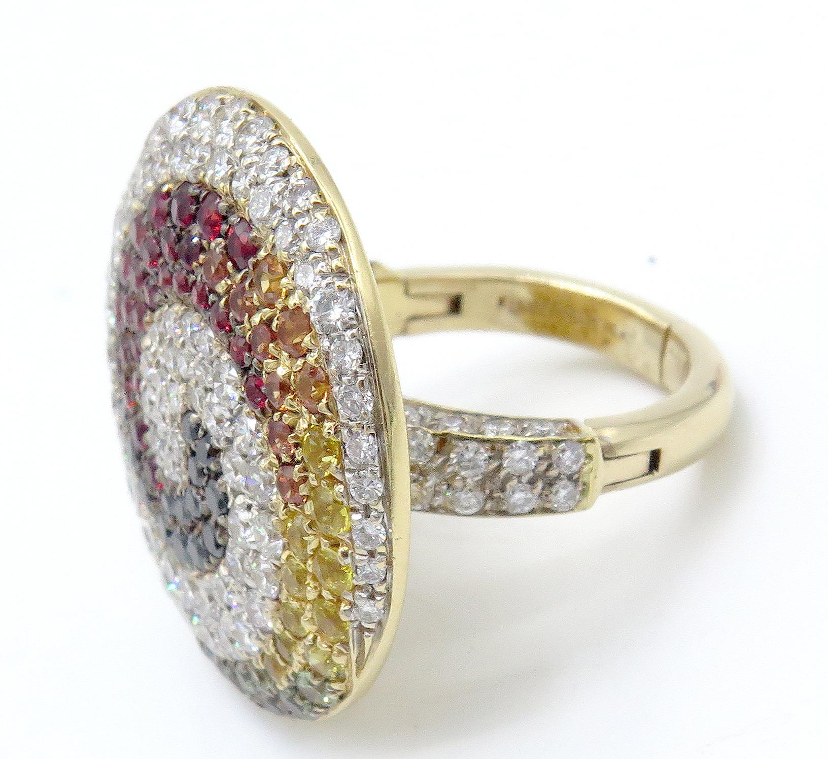 18K yellow gold Valente Milano Swirl Ring with pave diamonds and multi-color sapphires. The fascinating arrangement of jewels that embellish the top of this fabulous ring, combined with diamonds with a spiral of of multi-colored sapphires. This