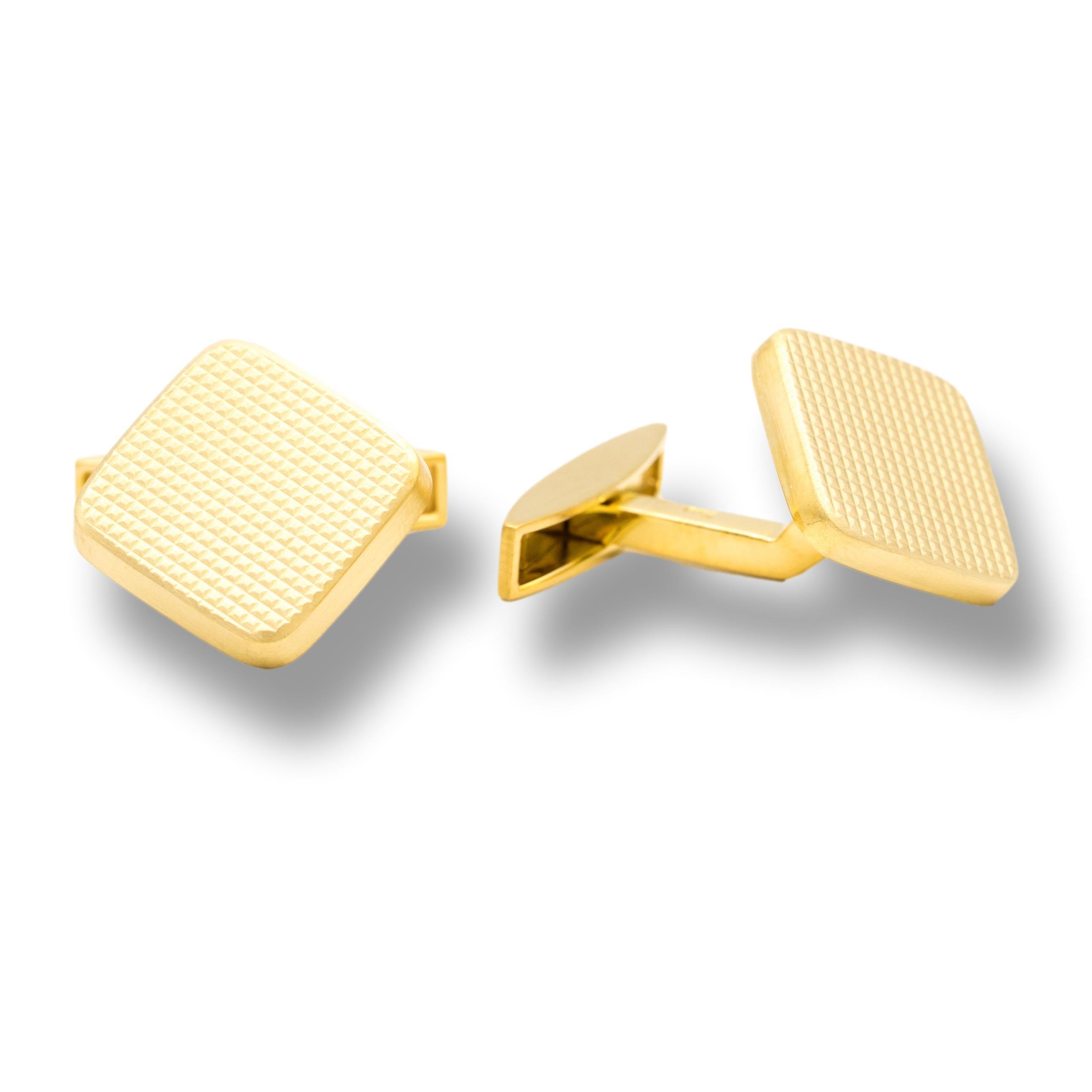 18K Yellow Gold Vintage Cuff Links with Waffle Design
Pair of waffle design cufflinks finely crafted in 18 karat yellow gold in excellent , like new condition  , recently re-polished and cleaned.  Combination of Satin and High polish finish create
