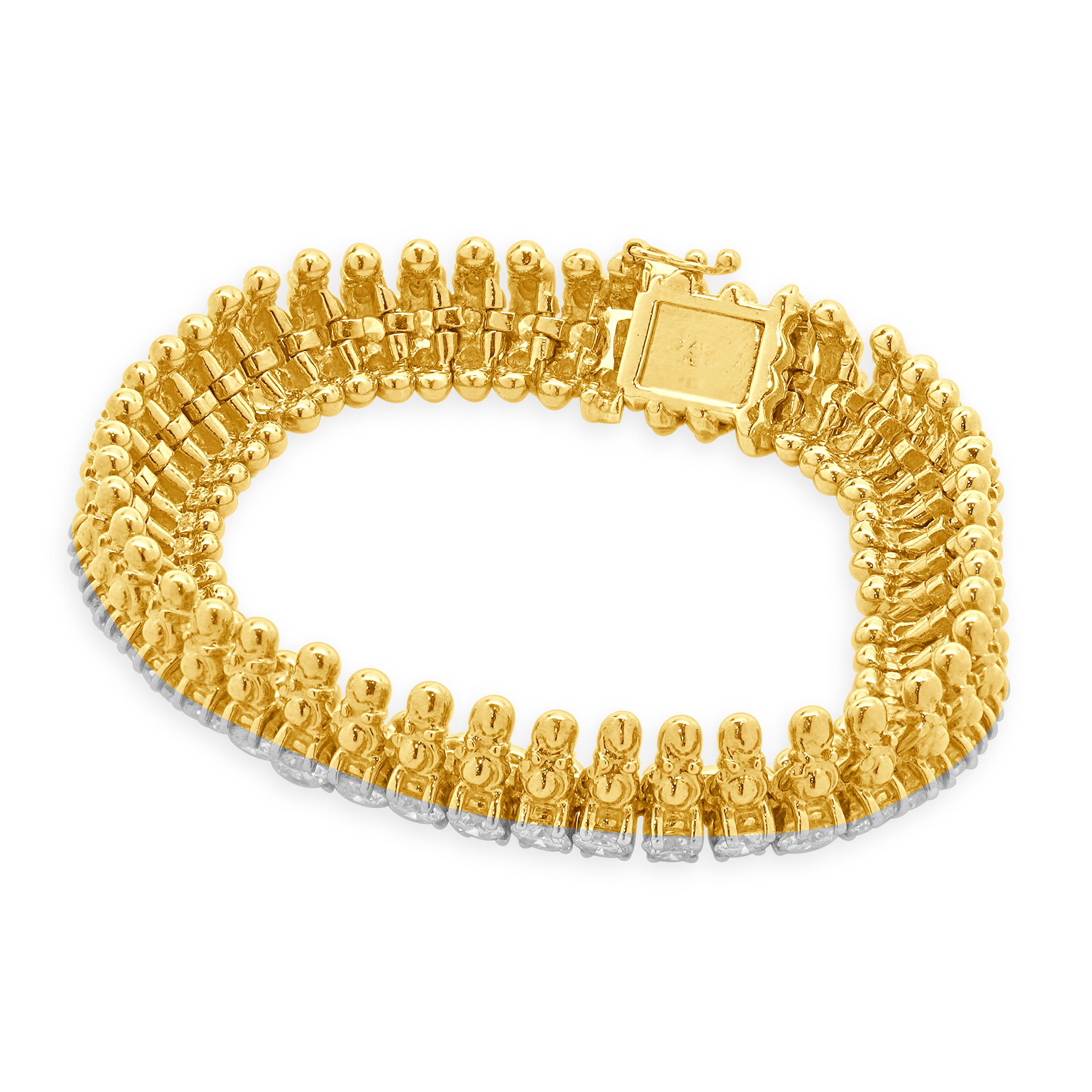 Designer: custom design
Material: 18K yellow Gold
Diamond: 48 round brilliant cut= 8.64cttw
Color: G
Clarity: SI1
Dimensions: bracelet will fit up to a 7-inch wrist
Weight: 55.80 grams
