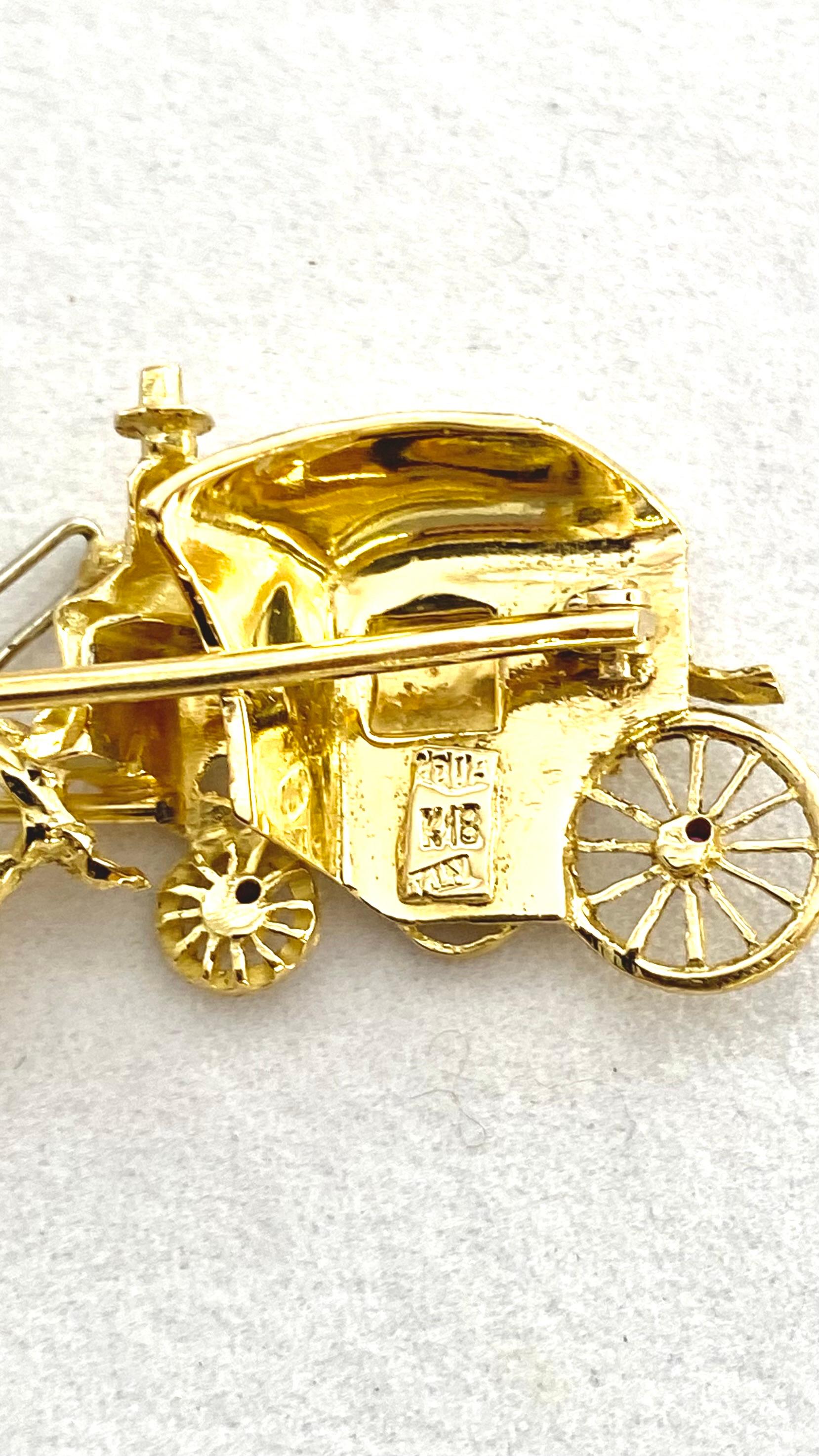 This exquisite Italian brooch is a masterpiece of vintage jewelry design, crafted from luxurious 18-karat yellow gold. The brooch features an enchanting 'Horse and Carriage' motif, beautifully detailed to capture the elegance and romance of a bygone
