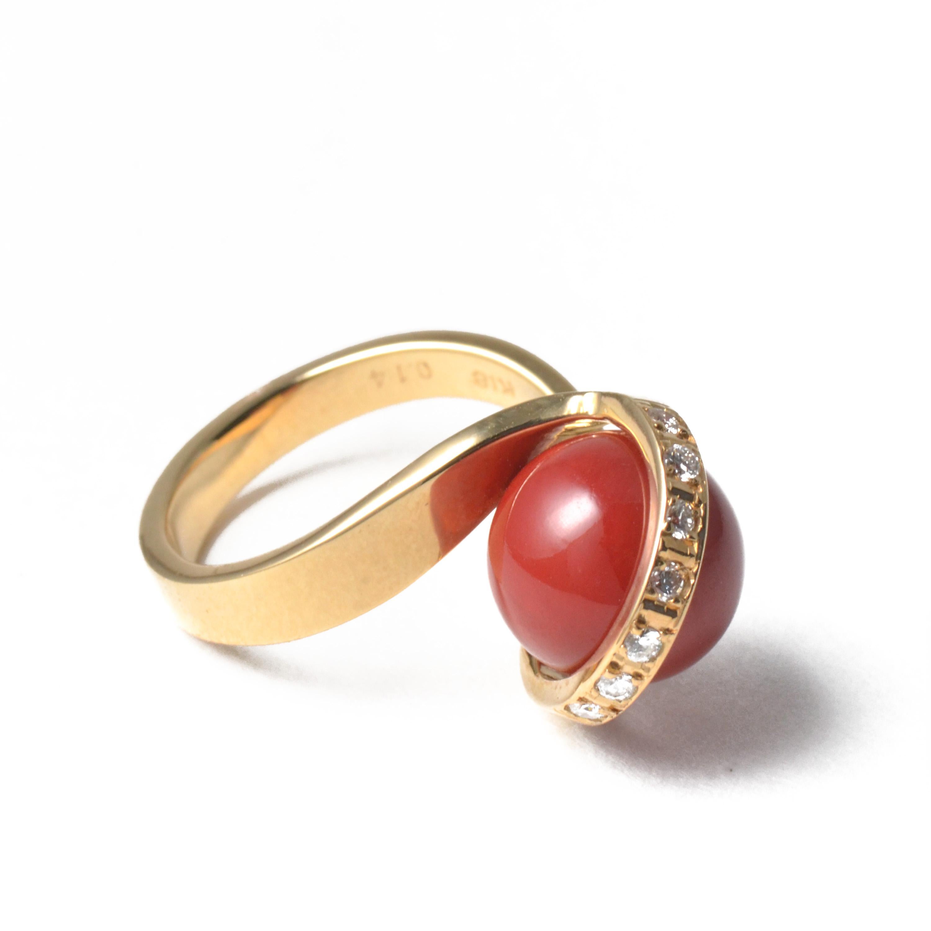 Vintage ring crafted in 18 karat yellow gold with Chiaka Sango (Oxblood Coral). The bead is approx. 10.5mm and the diamonds are 0.14carats. The 18 karat yellow gold setting exposes as much of the bead as possible to show off its flawless surface and
