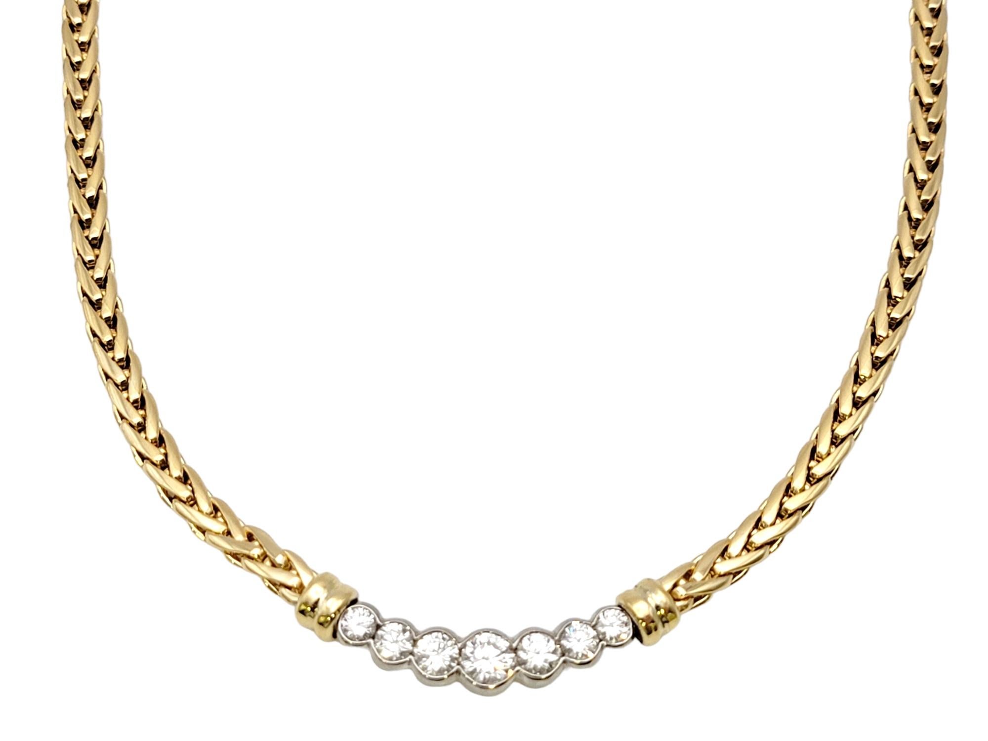 Indulge in the allure of refined luxury with this exquisite 18 karat yellow gold wheat chain choker necklace, adorned with seven round natural  diamonds. This captivating creation effortlessly combines timeless elegance with dazzling