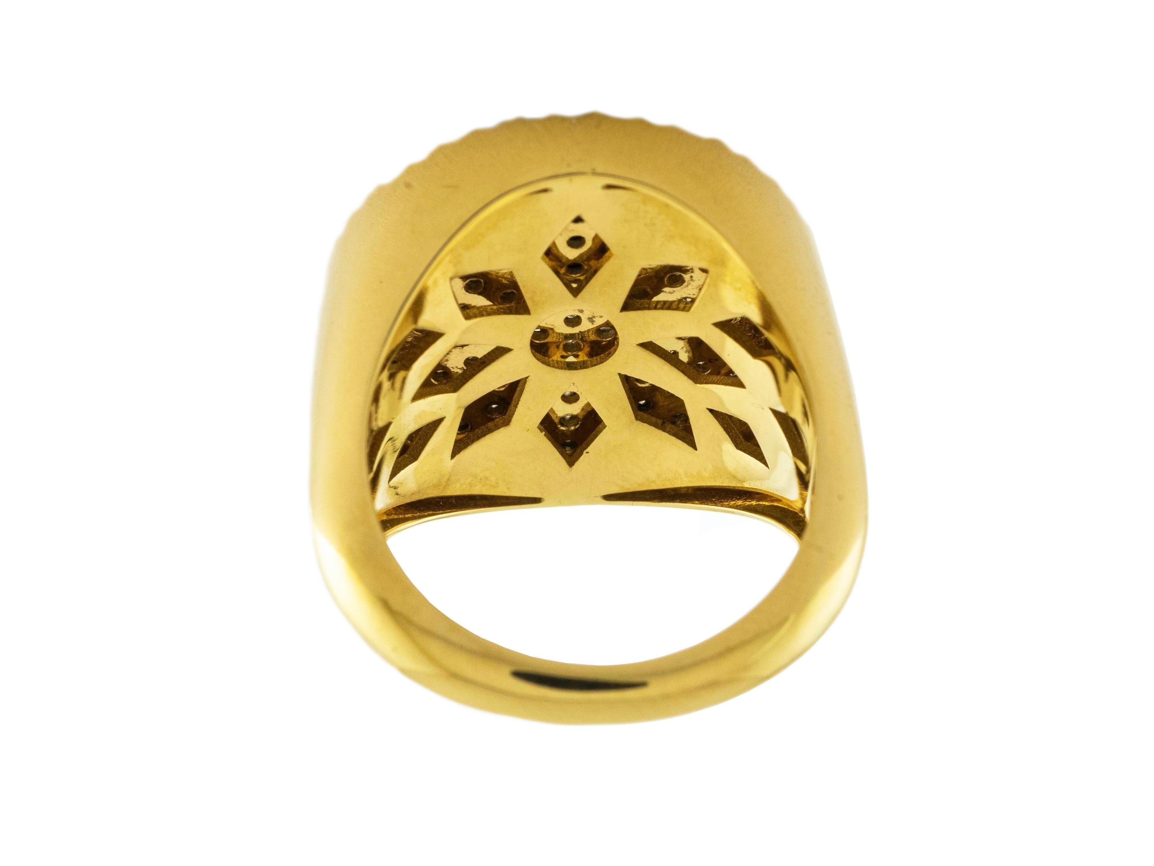 Round shaped cocktail ring. 
Made in solid 18 Karat yellow gold, the center is adorned with ct. 0.90 brown Diamonds pave surrounded by a second circle of white diamonds for ct. 0.38
Diameter of the circle is cm 2.00
Size 6
That ring can be