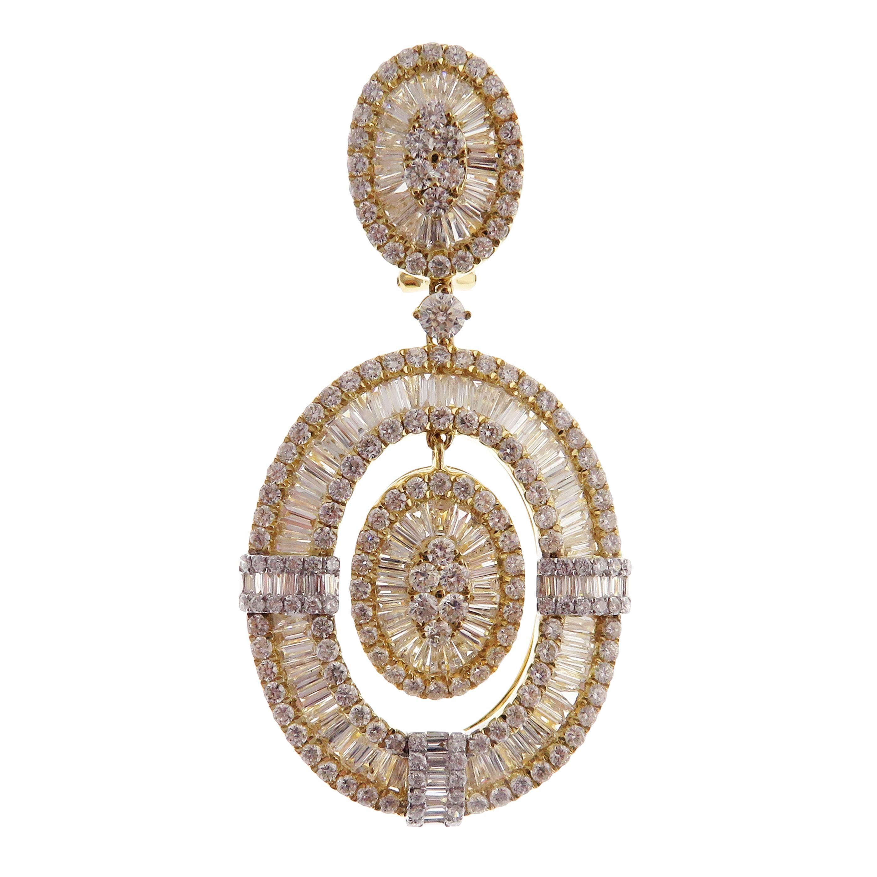 These modern oval baguette earrings are crafted in 18-karat yellow gold, weighing approximately 12.37 total carats of SI-V Quality white diamond. French Clip backing. Beautiful white gold accent.

Our Ballroom Collection feature earrings for those