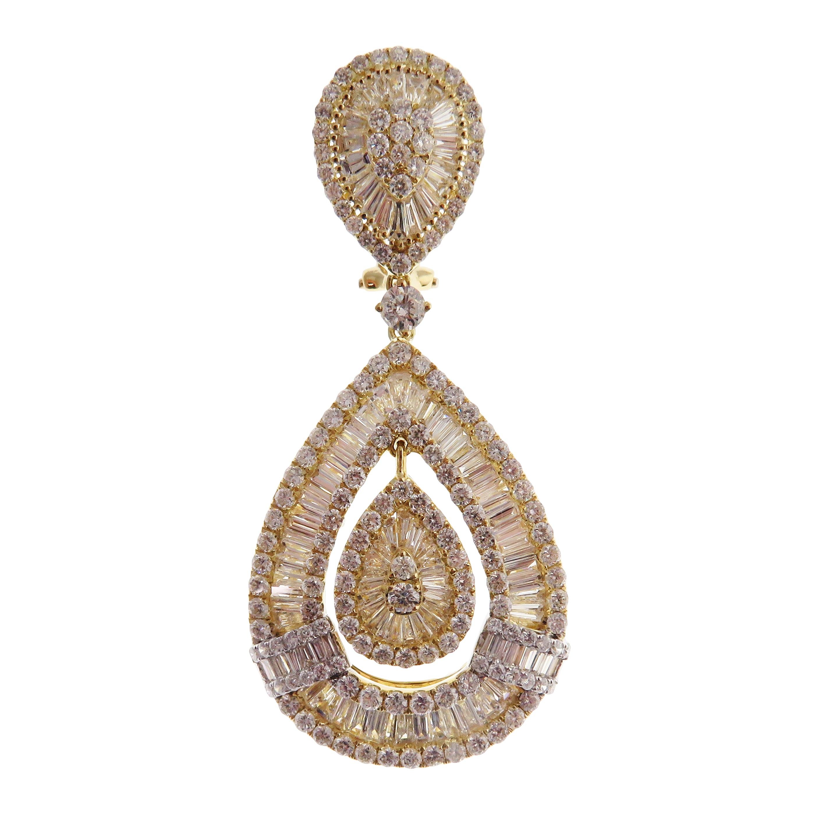 These modern pear baguette earrings are crafted in 18-karat yellow gold, weighing approximately 9.85 total carats of SI-V Quality white diamond. French Clip backing. Beautiful white gold accent.

Our Ballroom Collection feature earrings for those