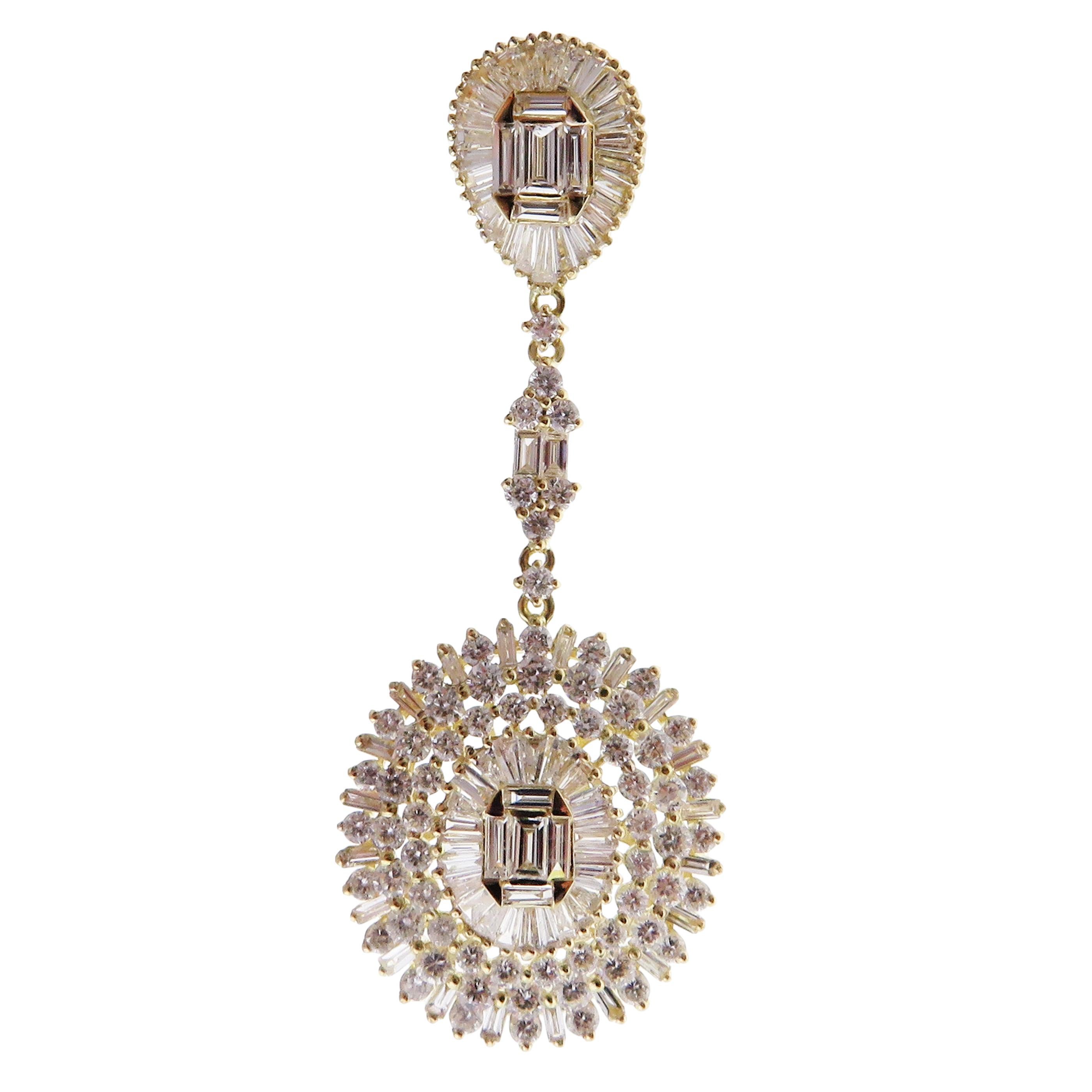 These oval baguette earrings are crafted in 18-karat yellow gold, weighing approximately 6.92 total carats of SI-V Quality white diamond. Post-style backing. 

Our Ballroom Chandelier Collection feature earrings for those with bold/classy aesthetics