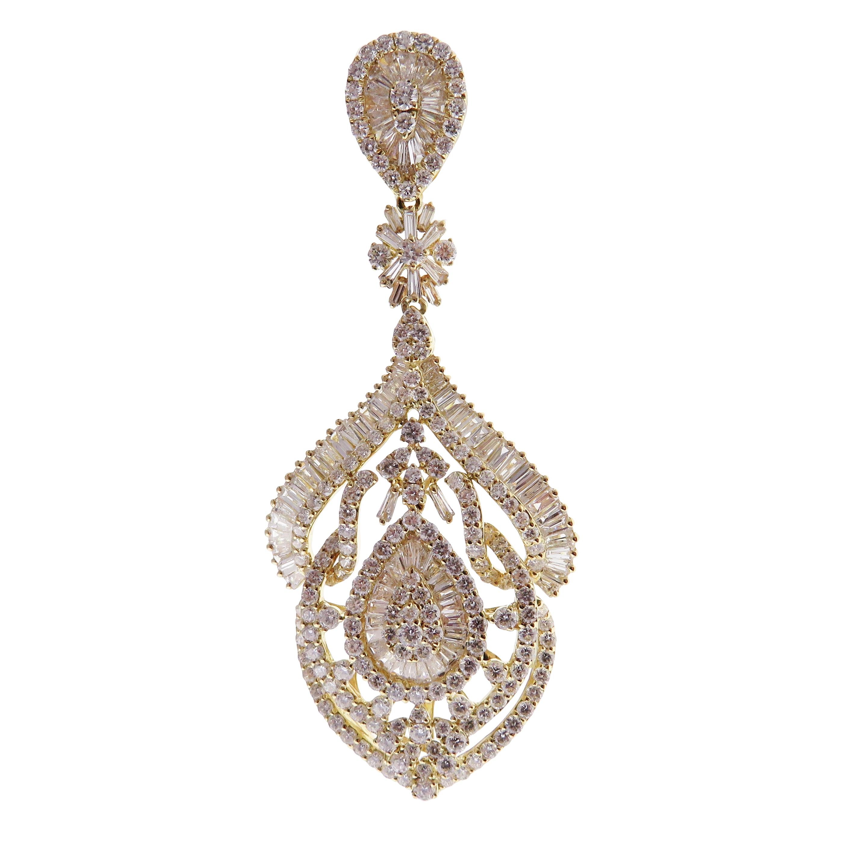 These pear curved chandelier earrings are crafted in 18-karat yellow gold, weighing approximately 11.71 total carats of SI-V Quality white diamond. French clip backing. 

Our Ballroom Chandelier Collection feature earrings for those with bold/classy