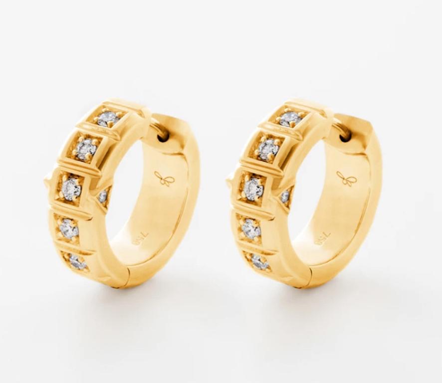 18 Karat Small Carousel Hoops are set in solid 18k Yellow Gold with a single row of white diamonds on each hoop and finished with a seamless secure pop in closure.
18k Yellow Gold, White Diamonds
From the James Banks Code Collection 
