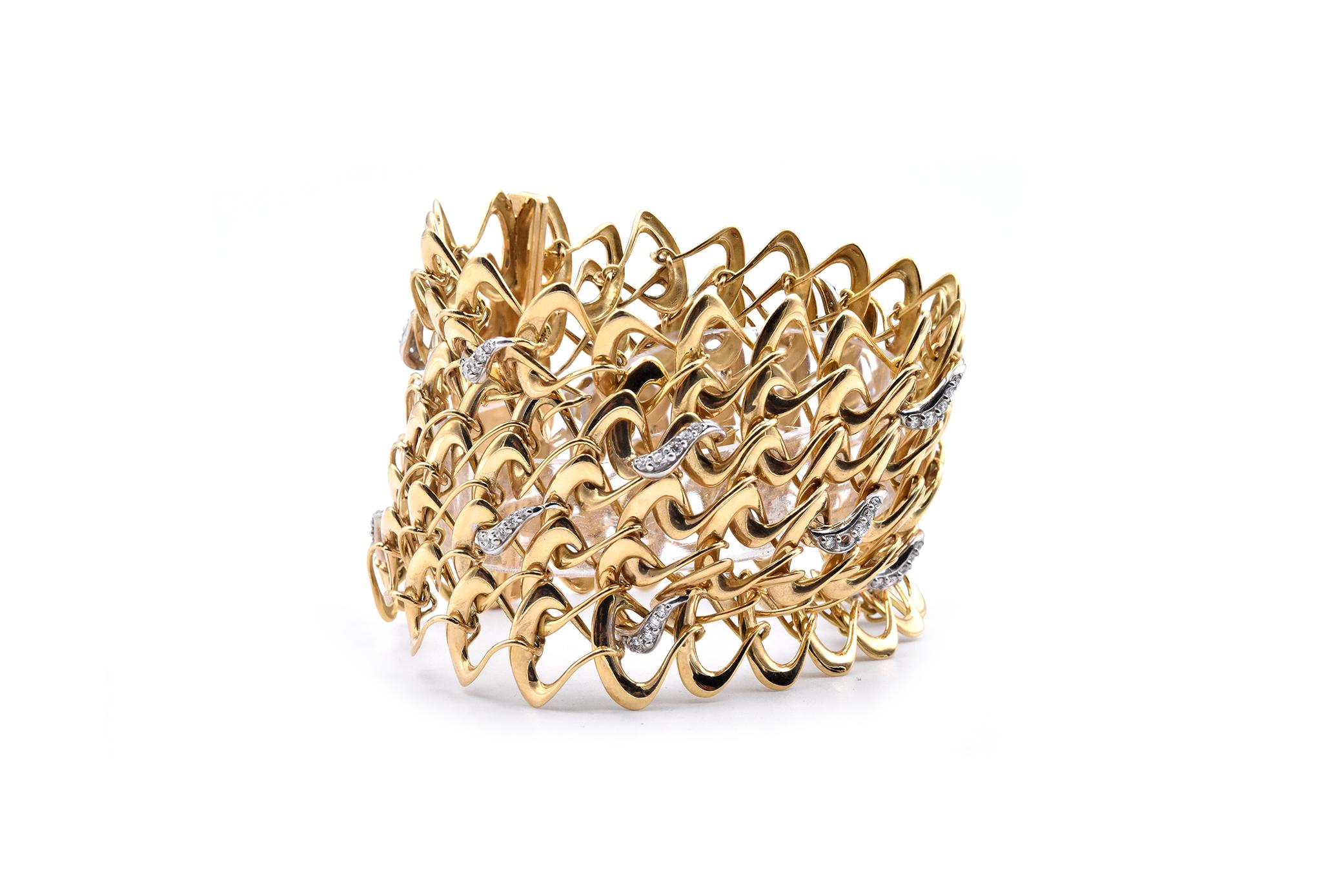 Material: 18K yellow gold 
Diamonds:  70 round cut = 1.40cttw
Color: G
Clarity: VS
Dimensions: bracelet measures 7.25-inches long, 2-inches wide
Weight: 85.45 grams

