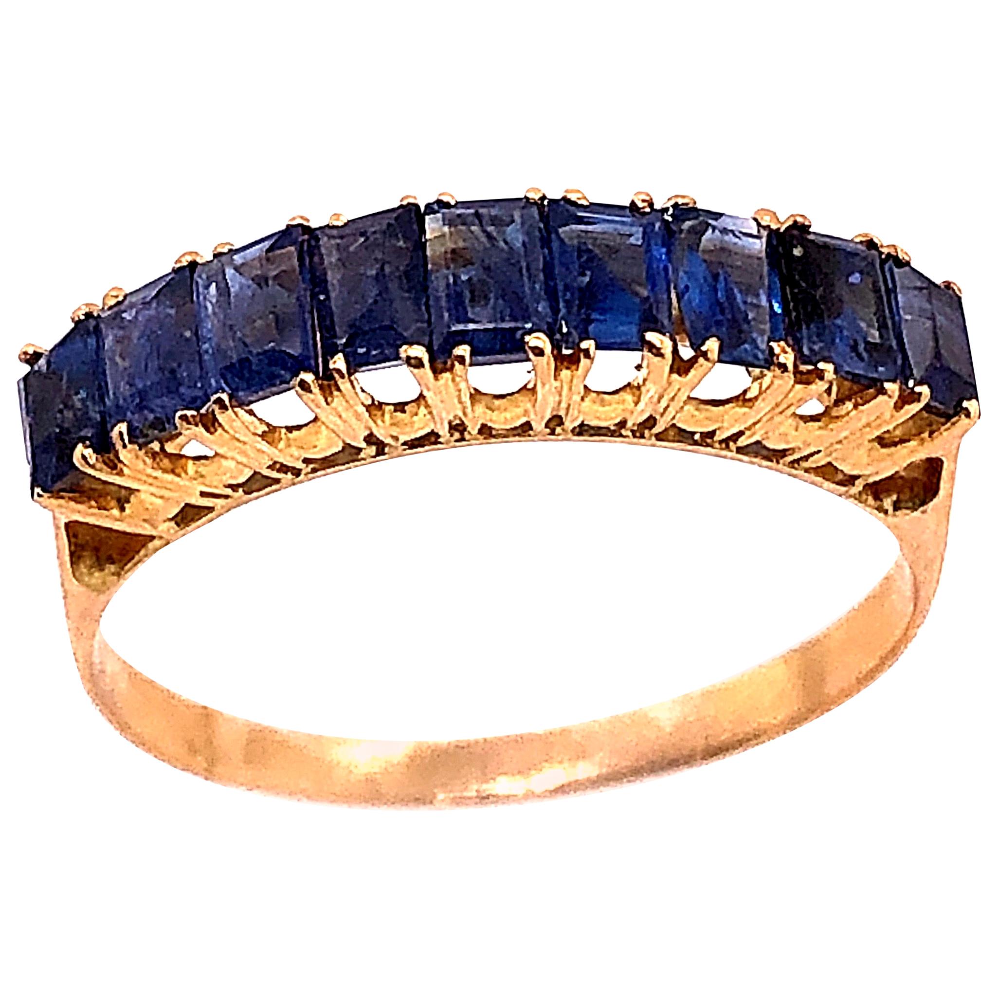 18 Karat Yellow Gold with Nine Sapphire Baguettes Band / Ring For Sale