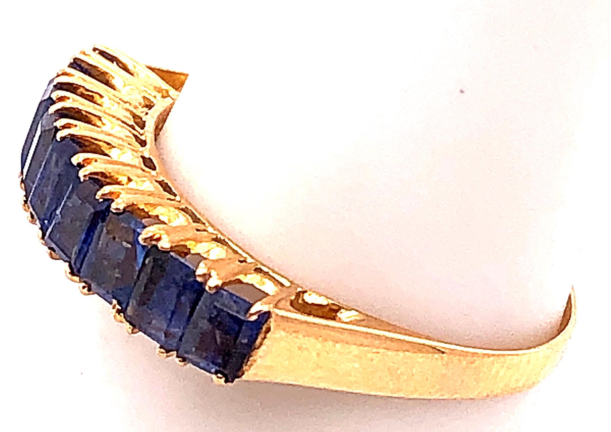 Baguette Cut 18 Karat Yellow Gold with Nine Sapphire Baguettes Band / Ring For Sale