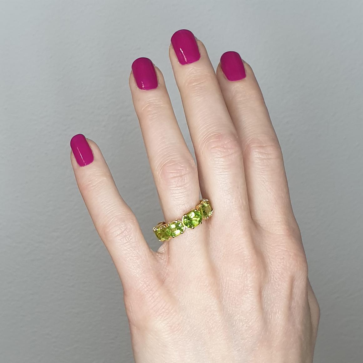 Classic and trendy ring , not only wedding ring but also a ring for every occasion with fantastic colors. Eternity ring. Design and craftmanship made in Italy by Stanoppi Jewellery since 1948.

Classic ring in 18 karat yellow gold with peridots oval