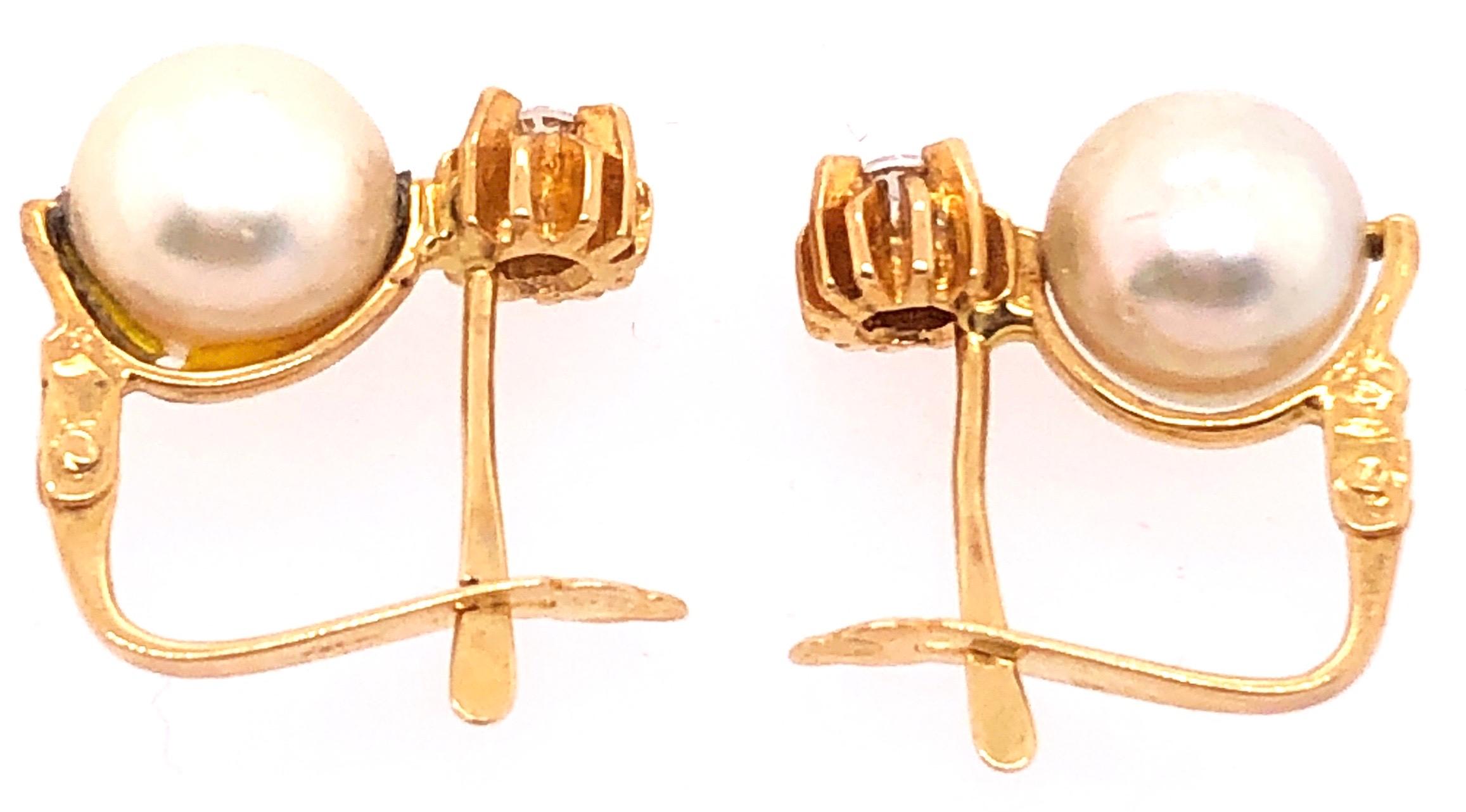 18 Karat Yellow Gold with Platinum Lever Back Pearl Earrings
3.66 grams total weight.

