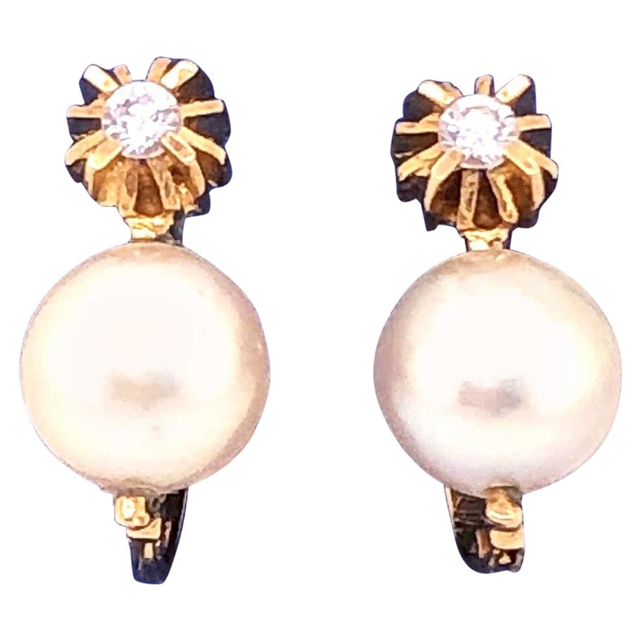 Boucles d'oreilles en or jaune 18 carats et platine avec perles à levier