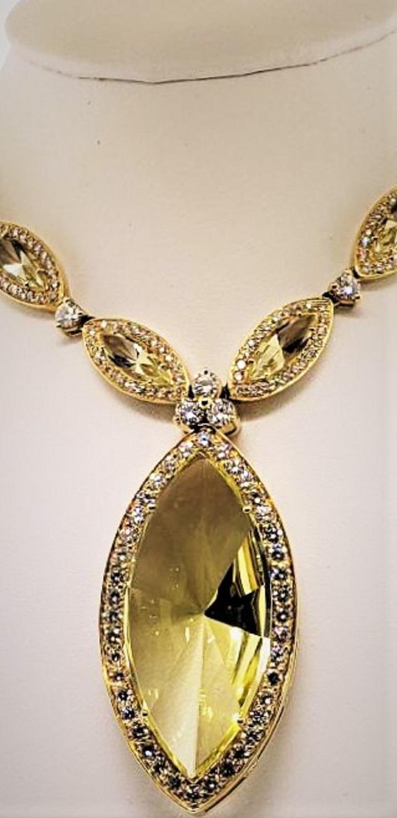 Designed, Created, and conceived by Michael Engelhardt, this beautifully crafted necklace will bring much life and happiness to the person wearing it.  The pendant is highlighted by a beautifully cut Marquis (31.79 carats) yellow quartz drop.  The